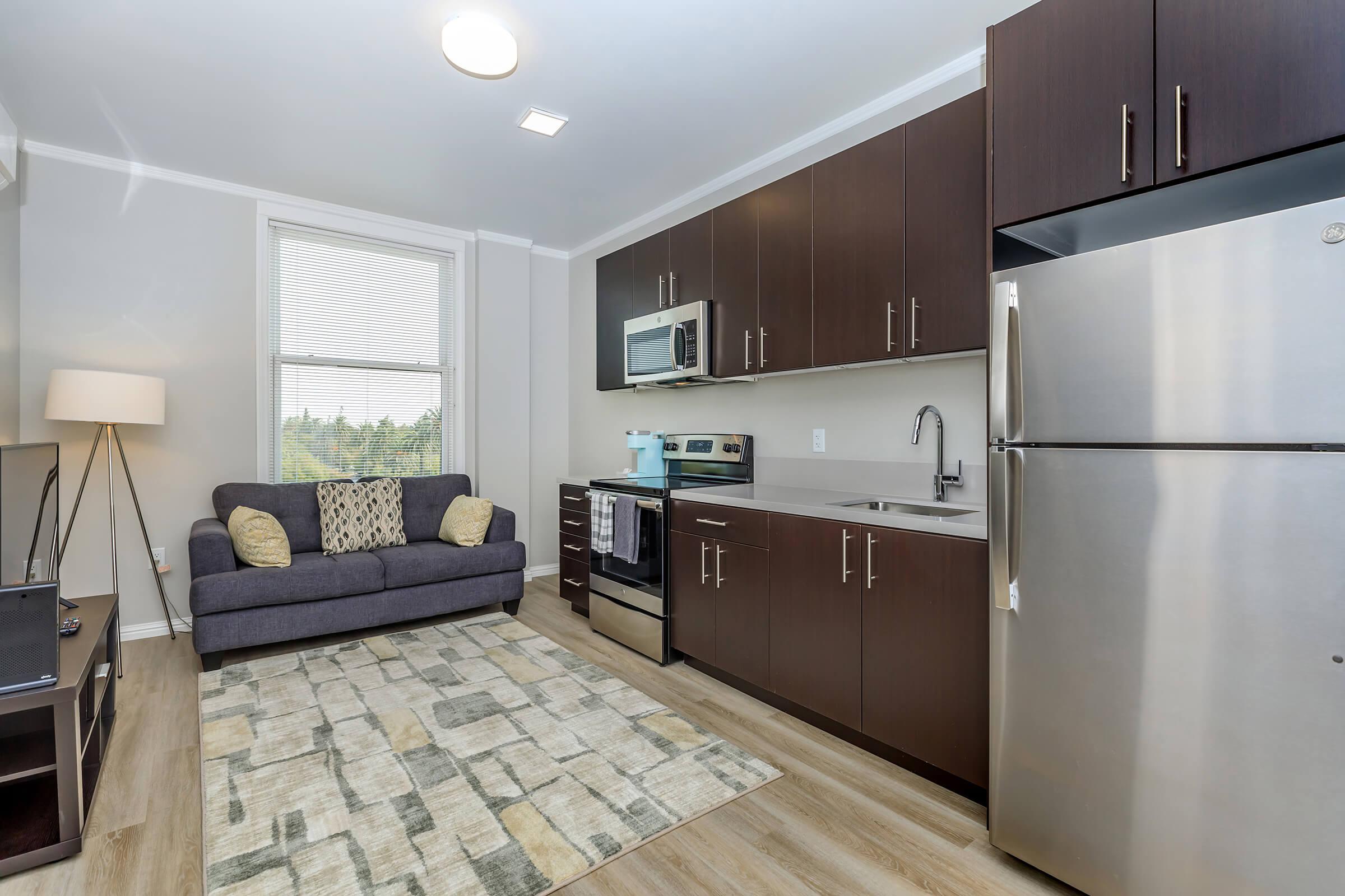 a modern kitchen with stainless steel appliances