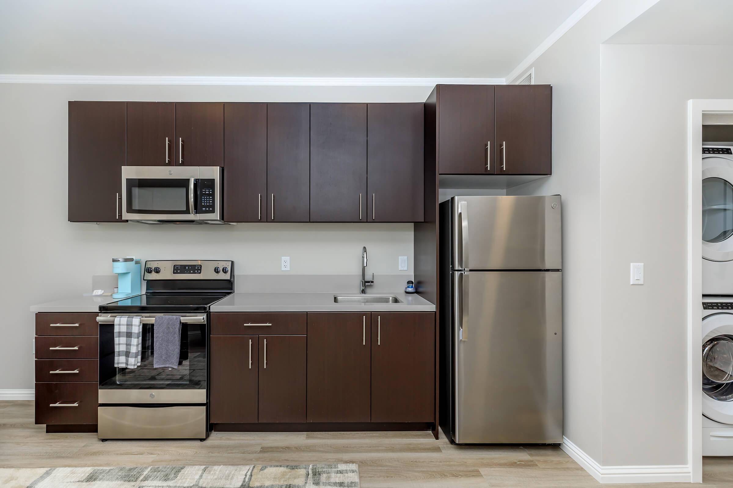 a modern kitchen with stainless steel appliances