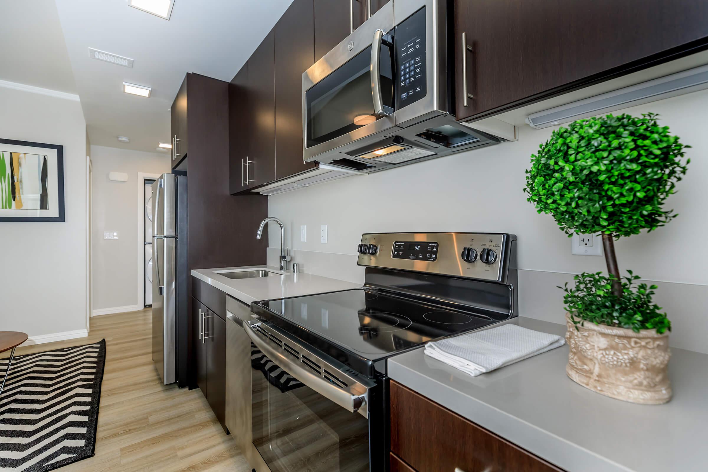 a stove top oven sitting inside of a kitchen