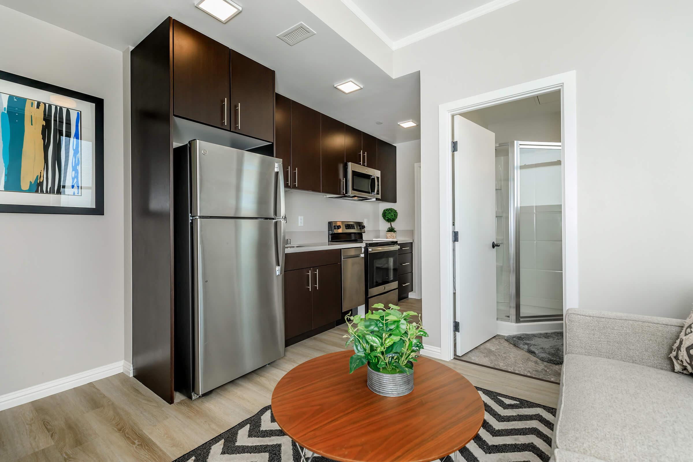 a kitchen with a sink and a mirror