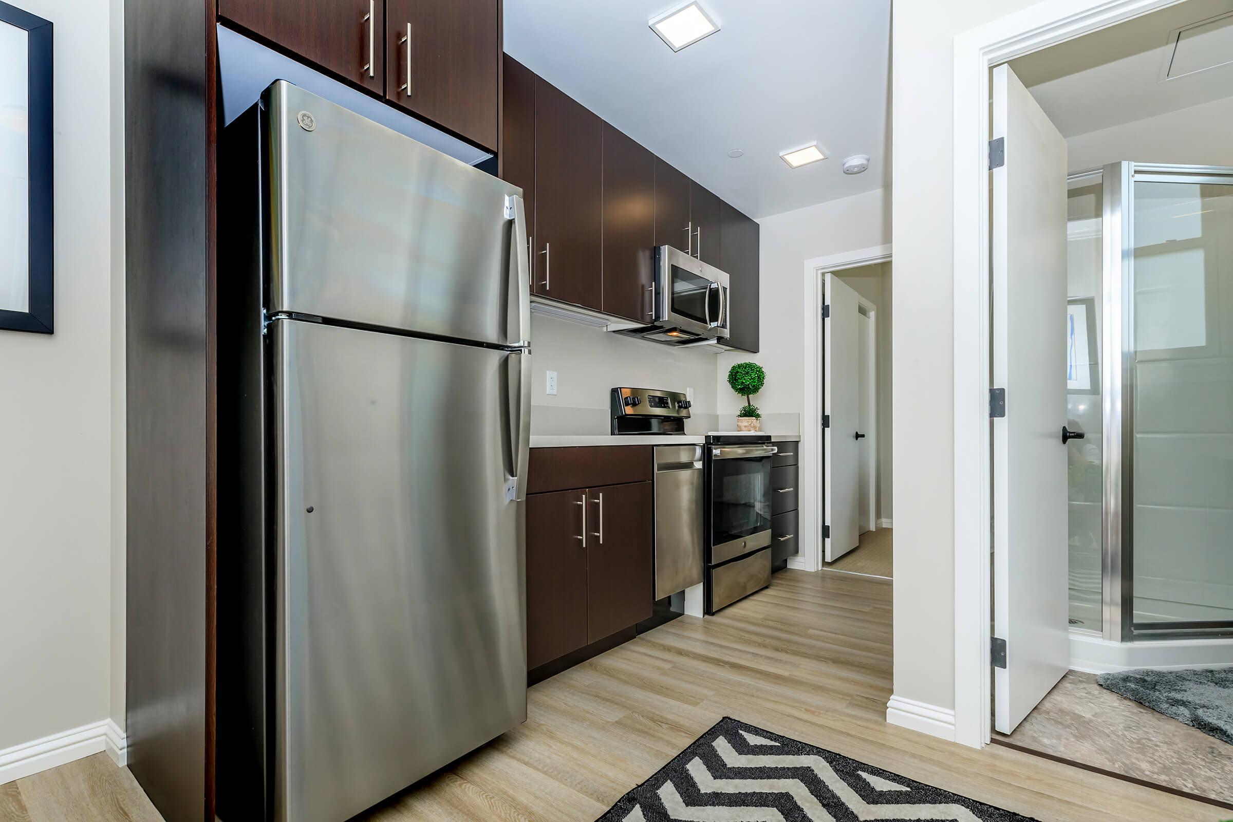 a kitchen with a sink and a refrigerator