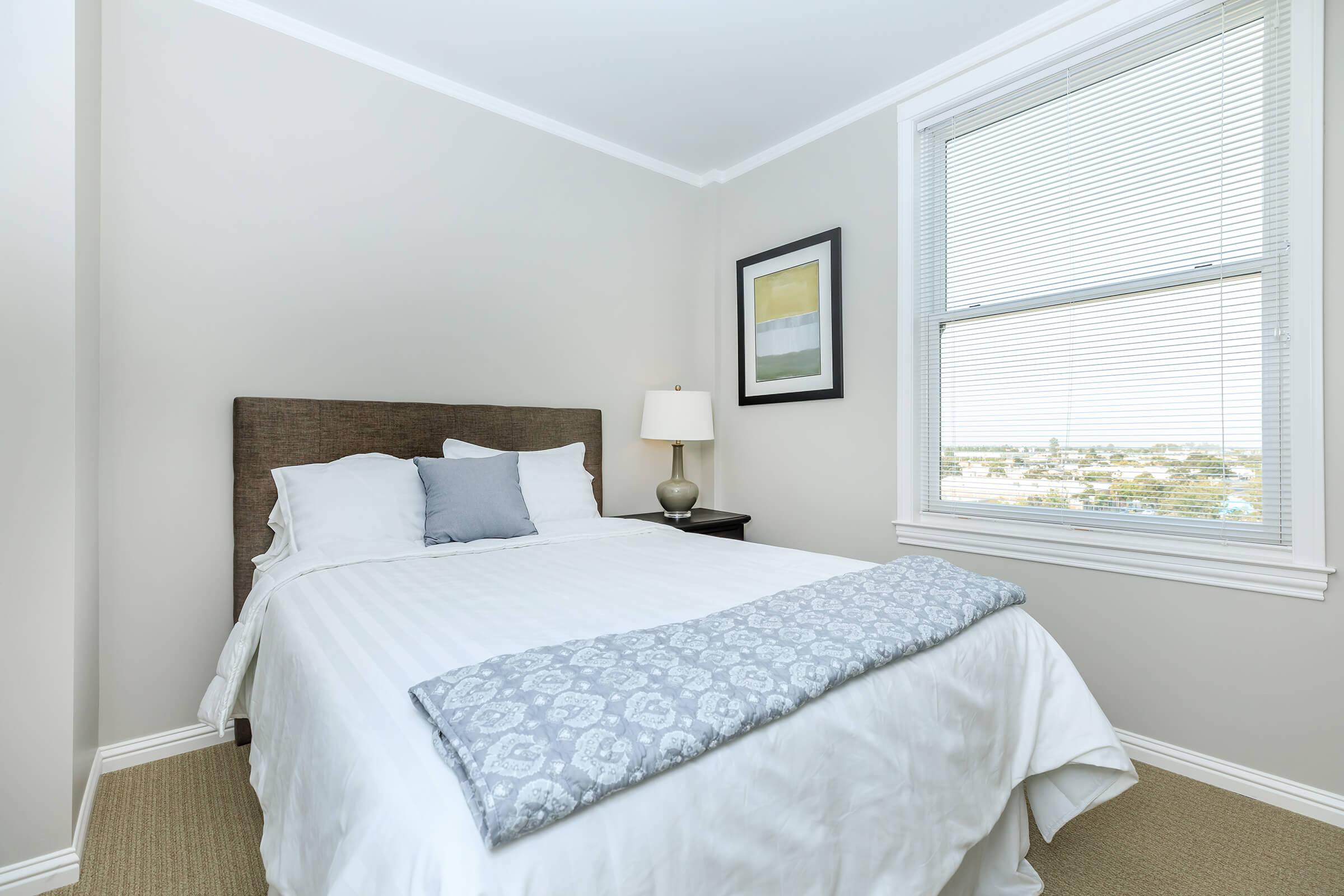 a bedroom with a bed in a hotel room