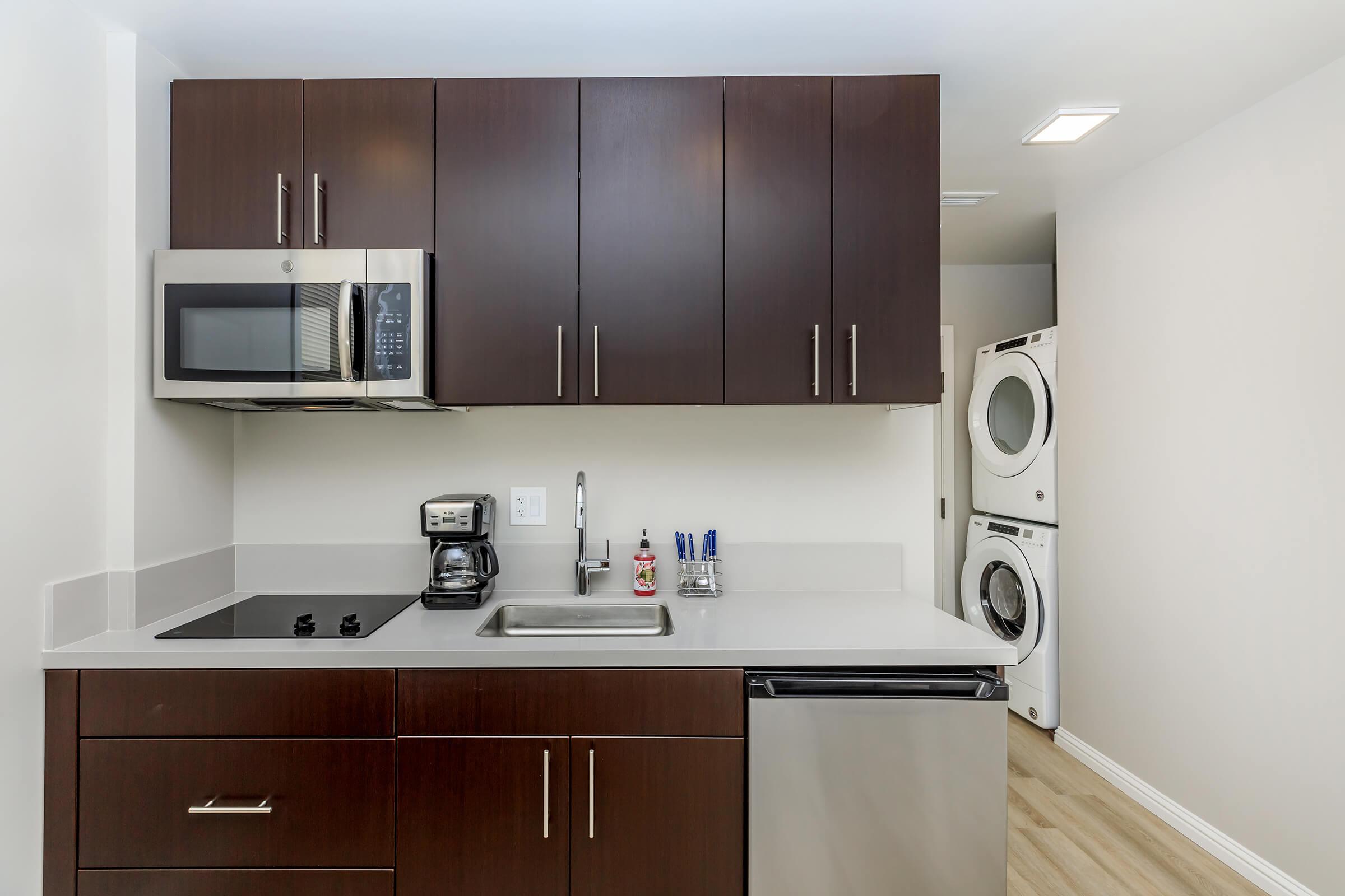 a kitchen with a sink and a microwave