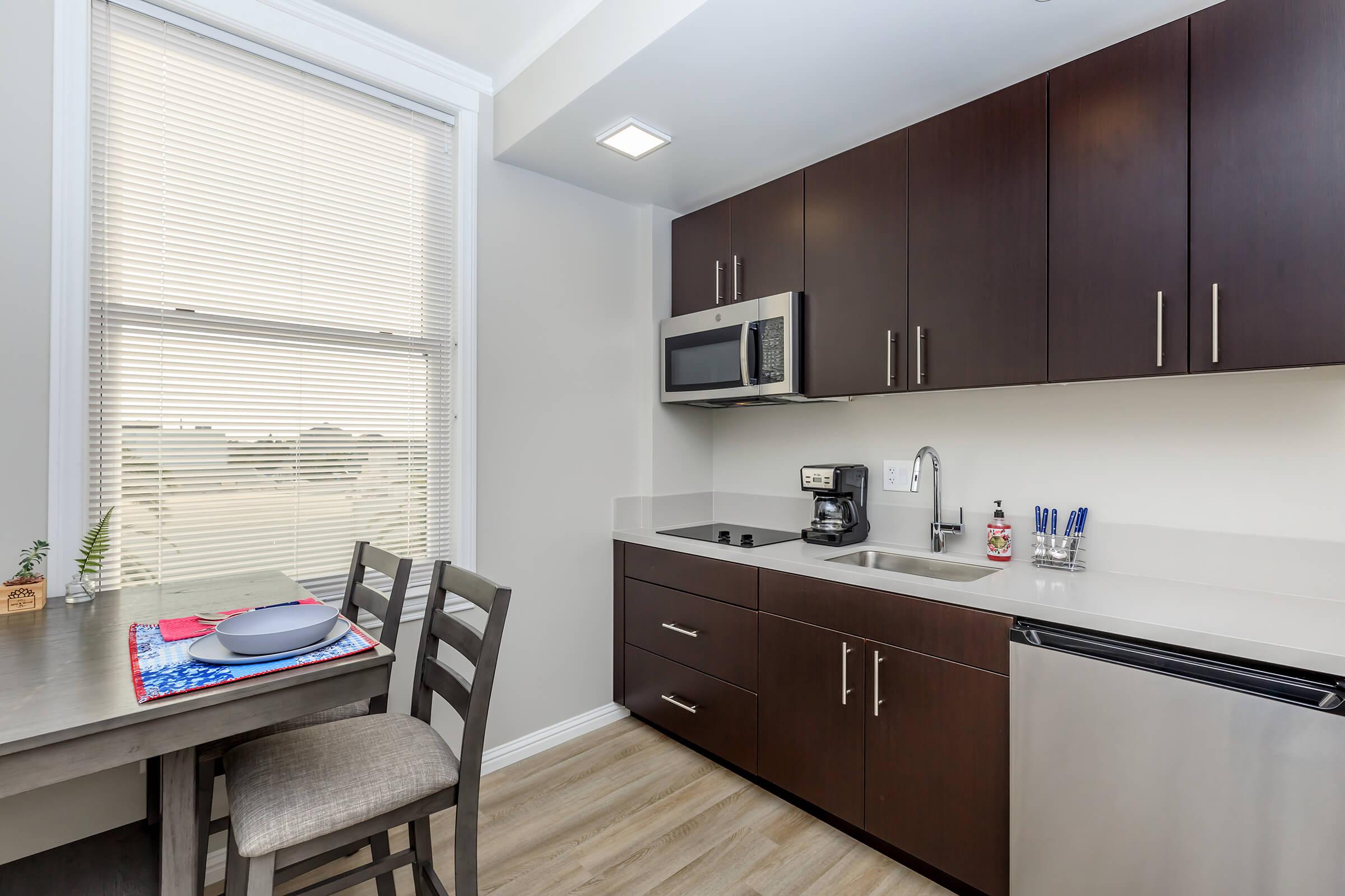 a kitchen with a sink and a window