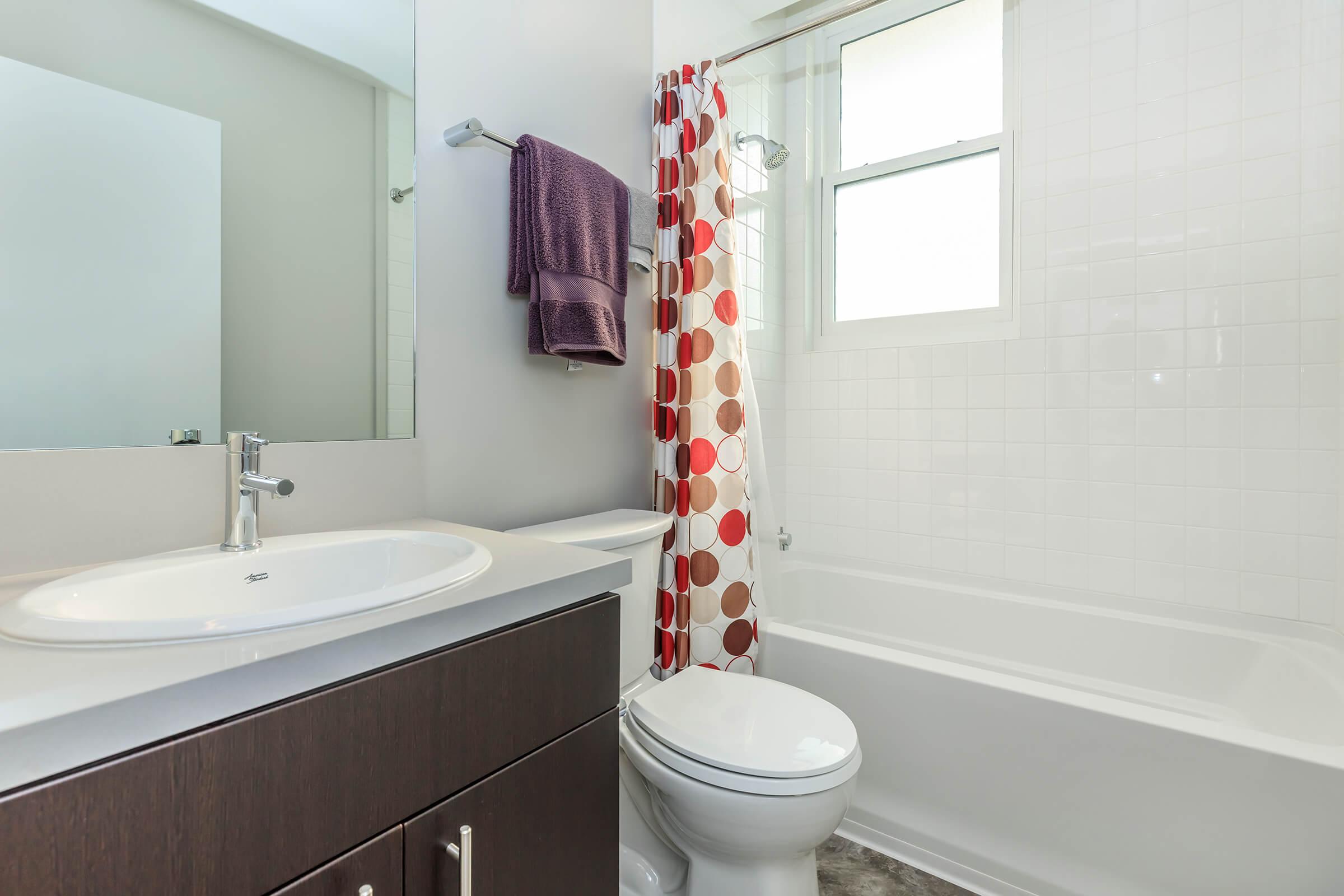 a shower that has a sink and a mirror