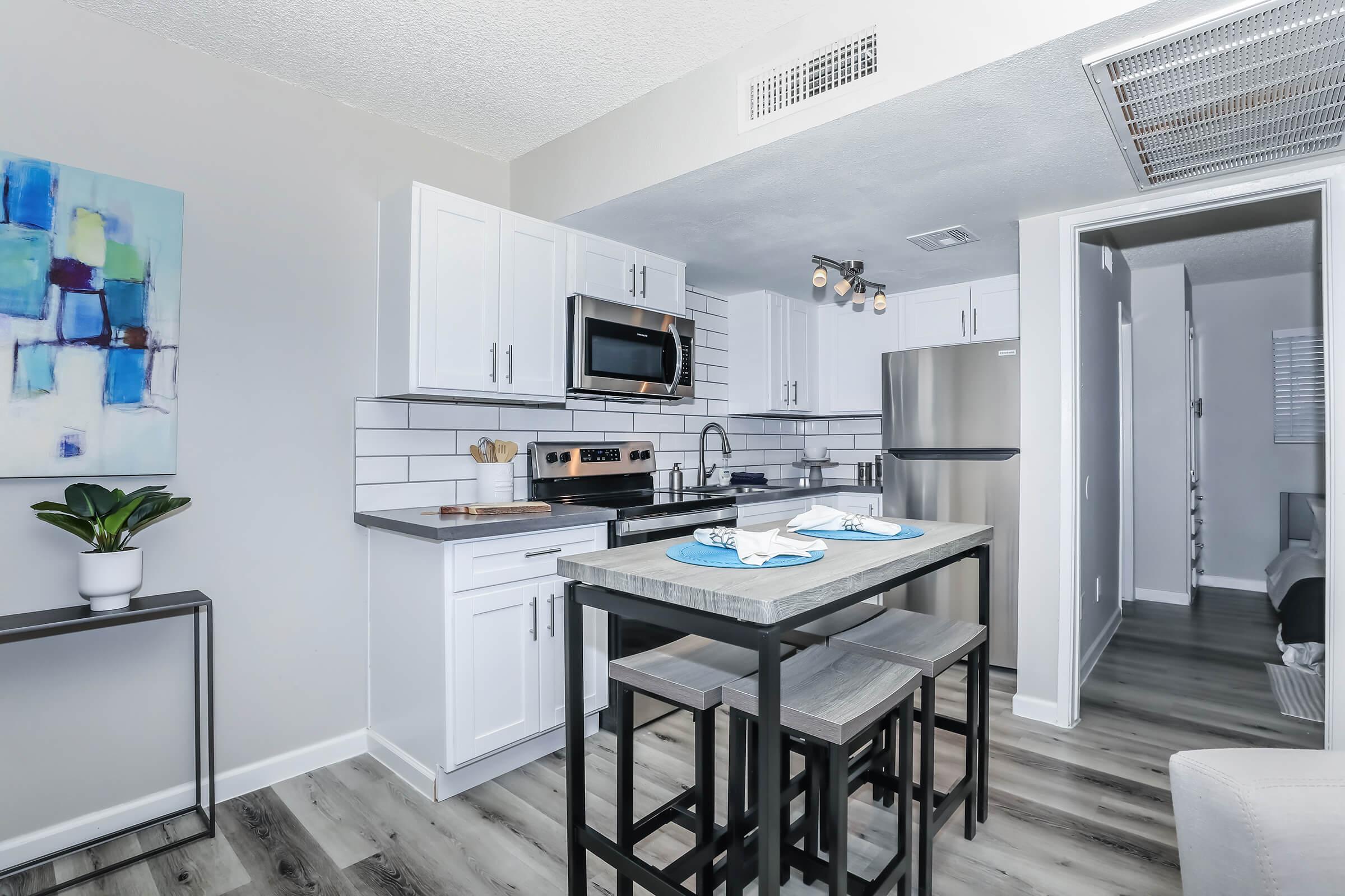 a kitchen with a table in a room