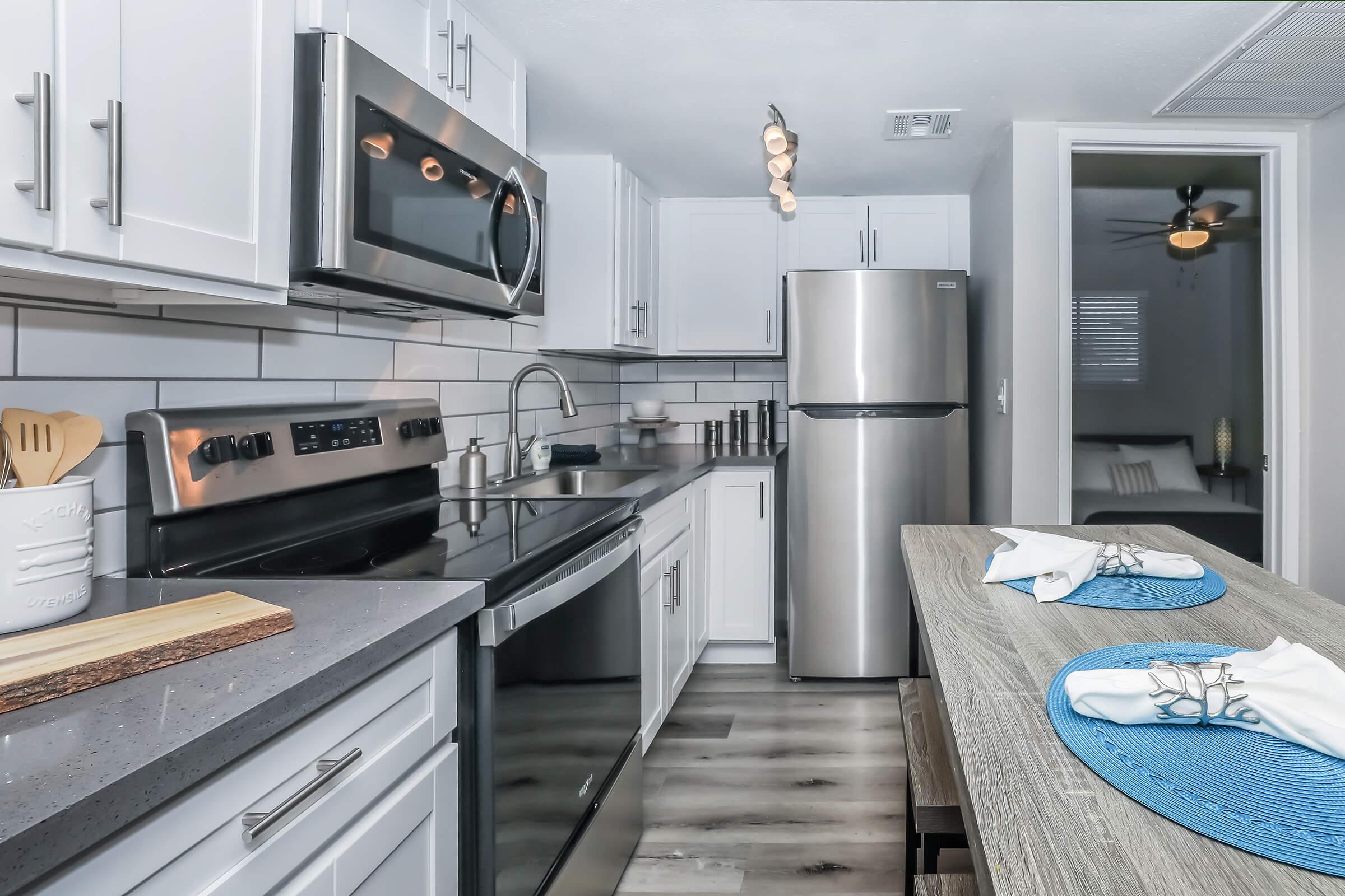 a kitchen with a blue background