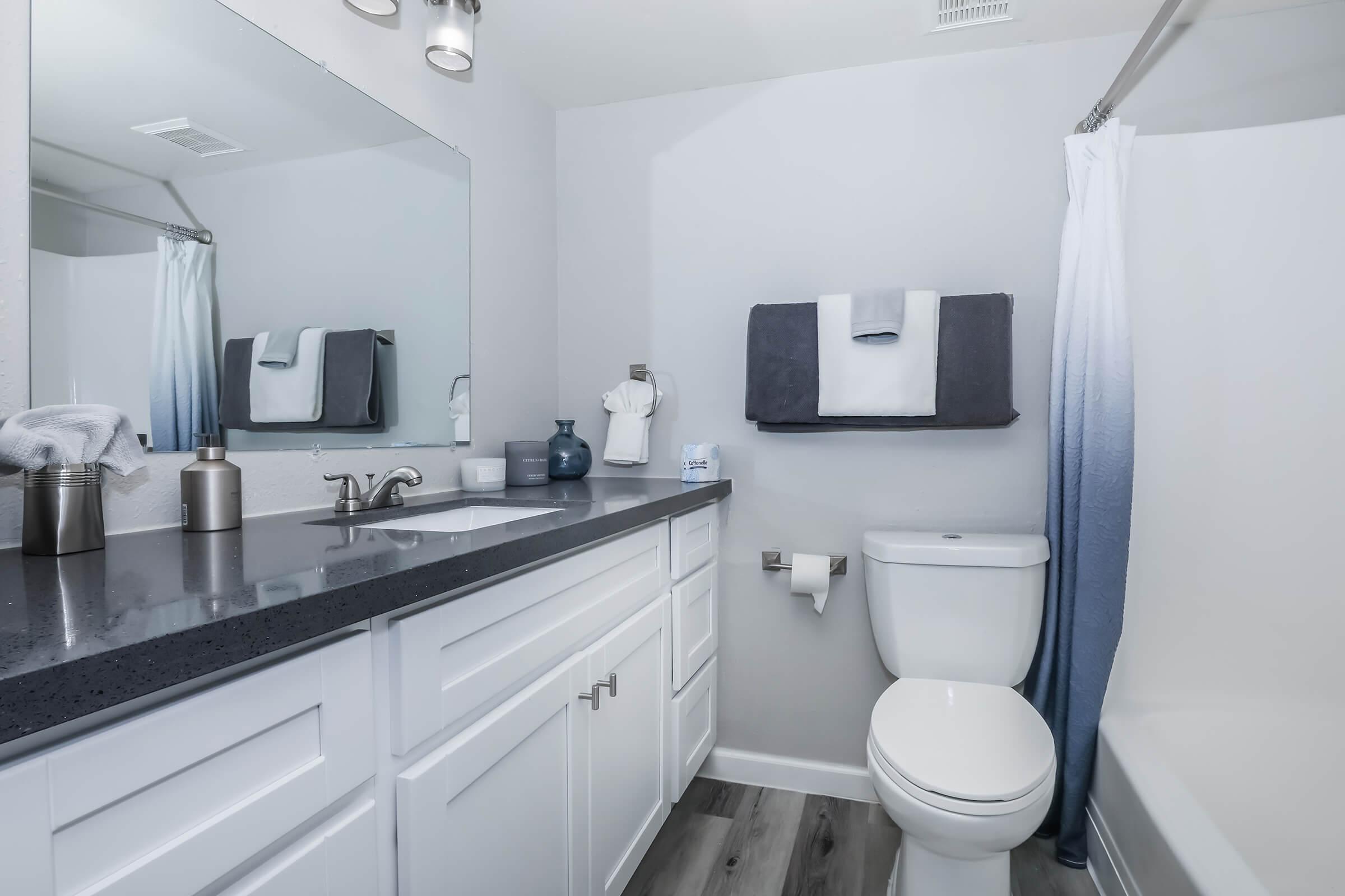 a kitchen with a sink and a mirror