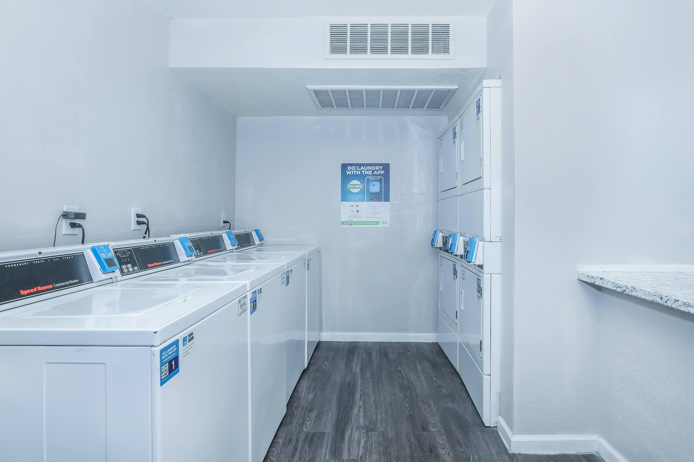 Community laundry room with washers and dryers