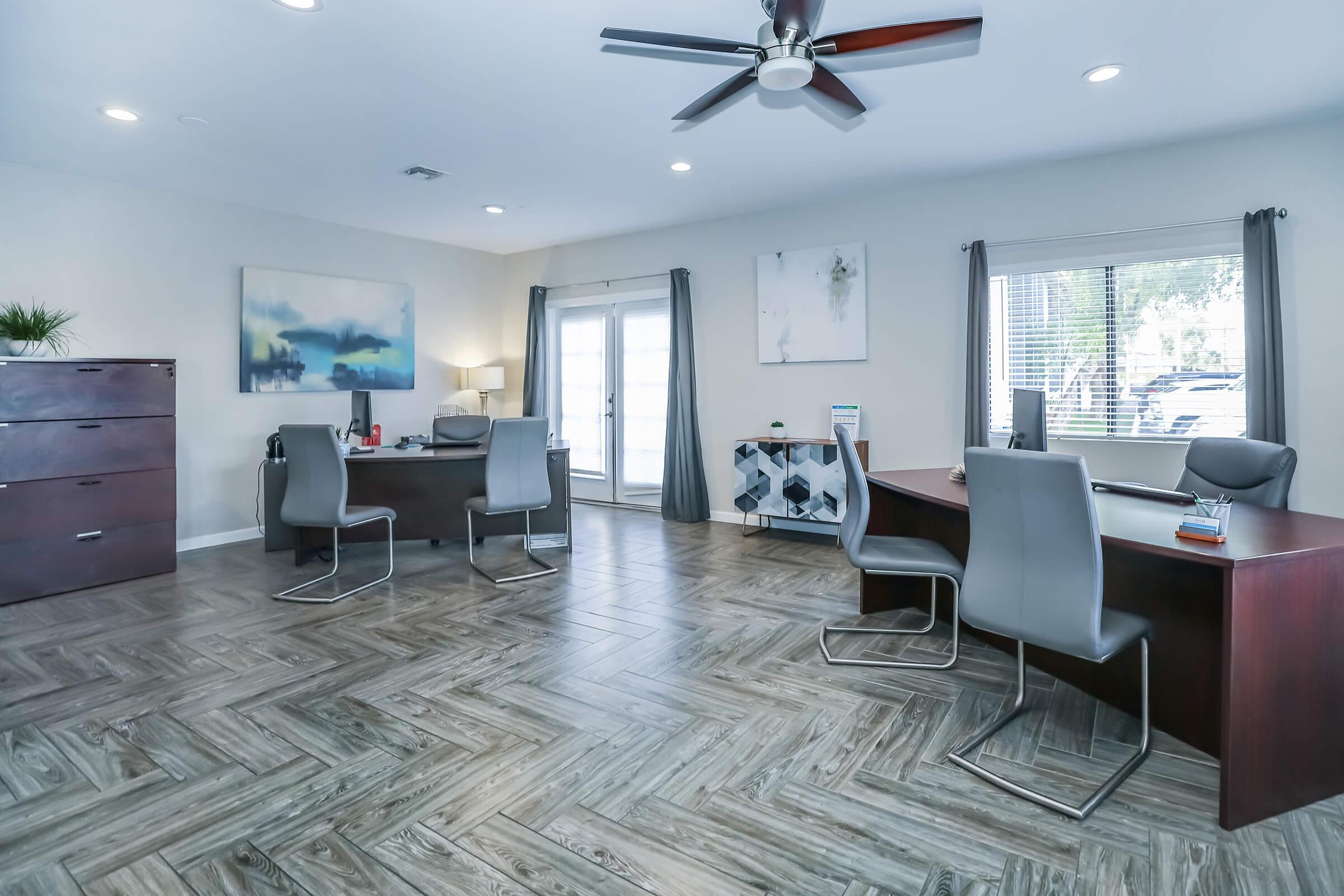 Modern apartment complex leasing office with 2 desk stations