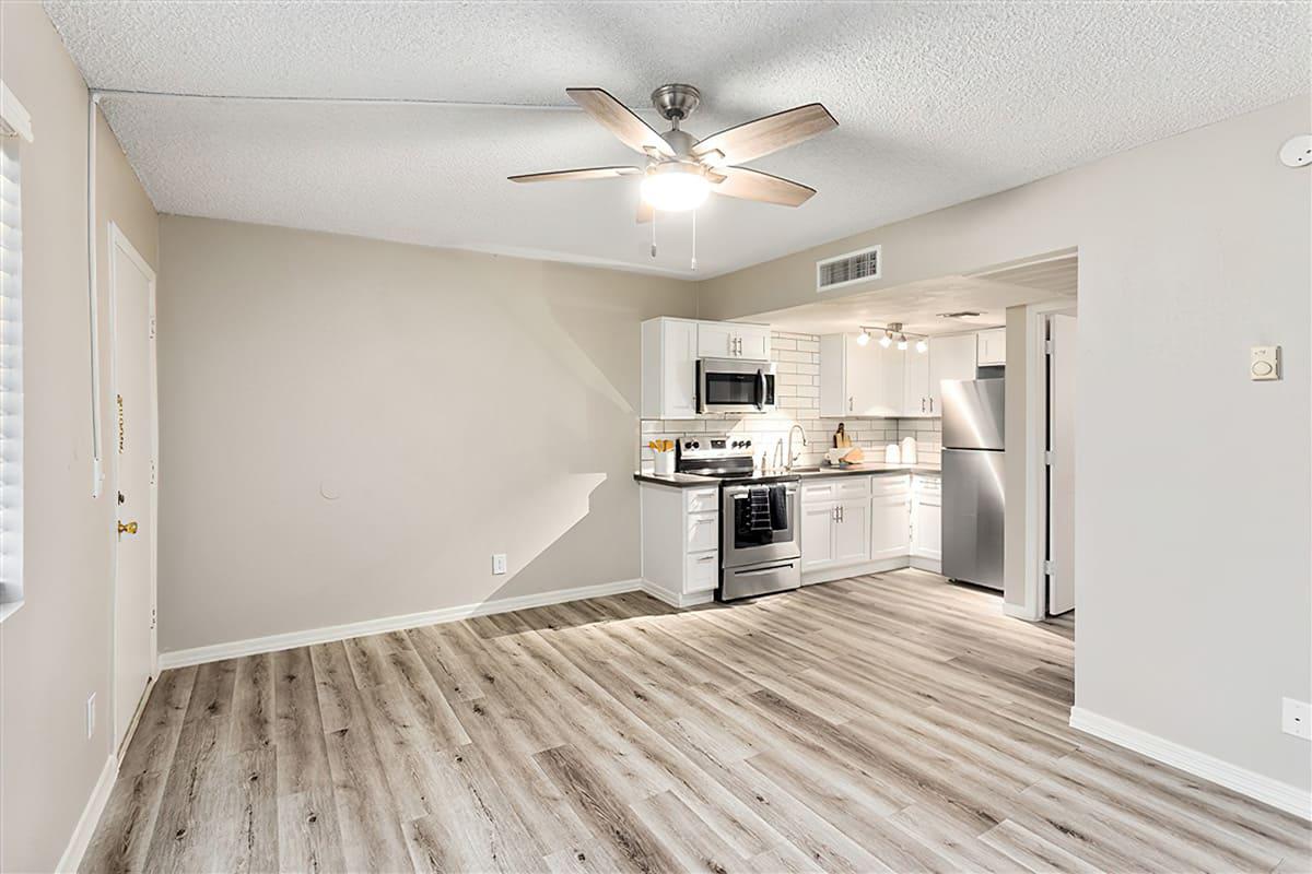 a kitchen with a wood floor