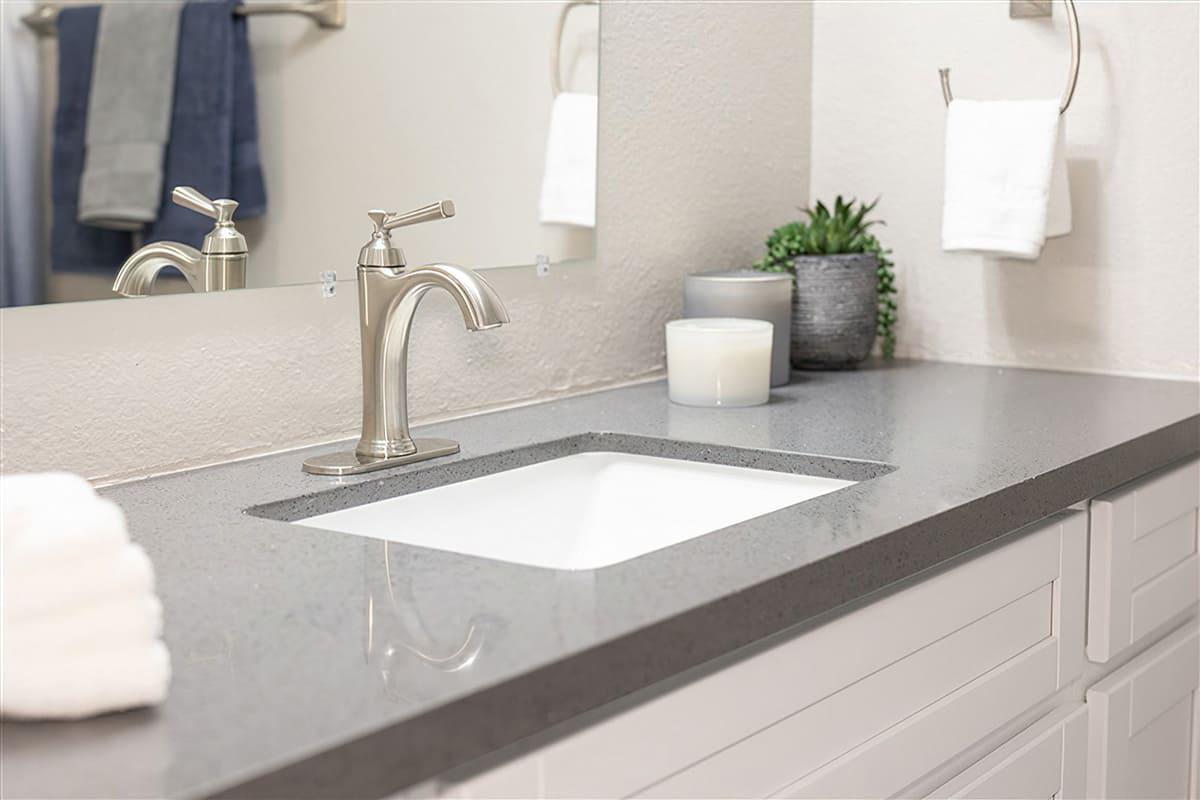 a double sink and large mirror