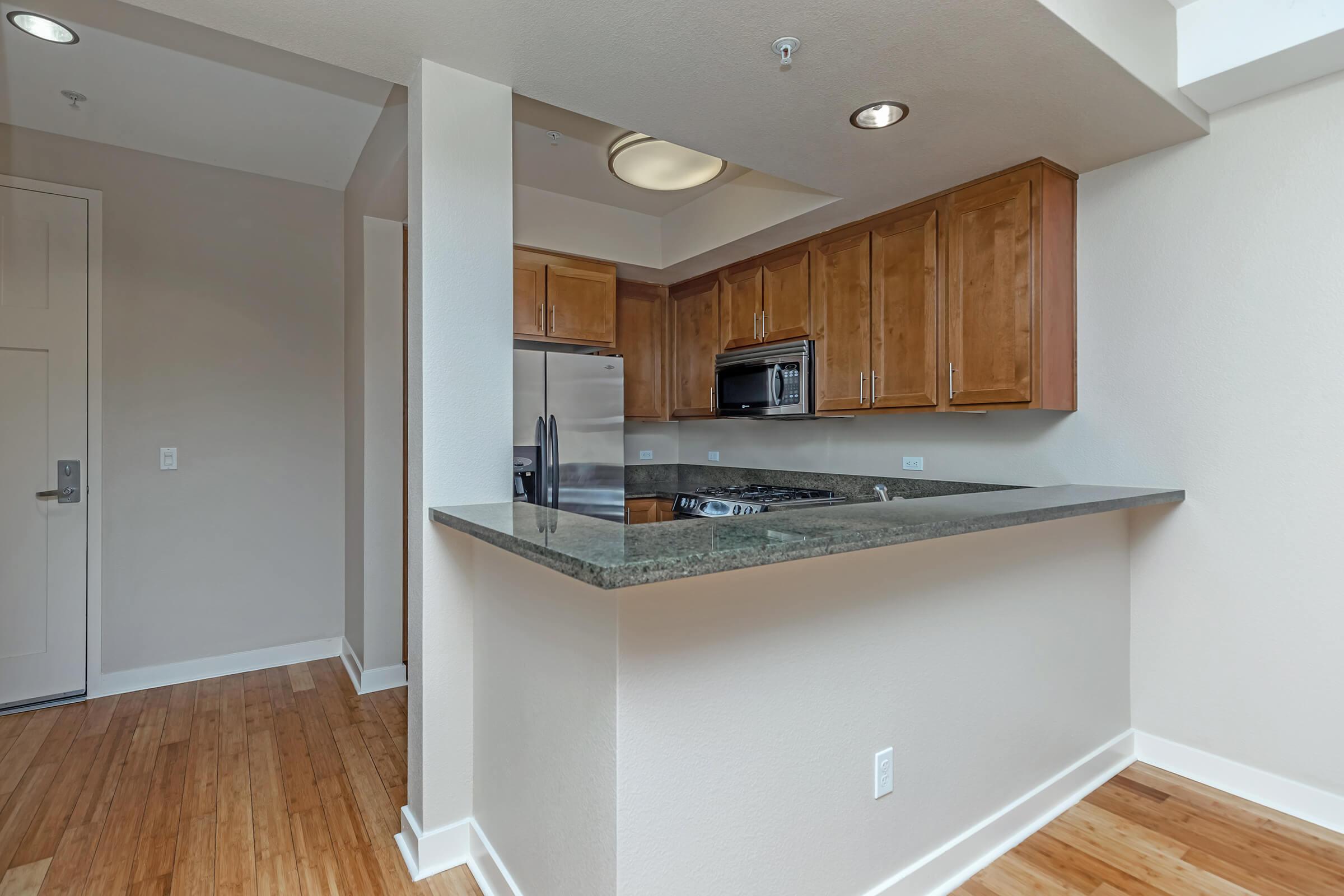 a kitchen with a wood floor