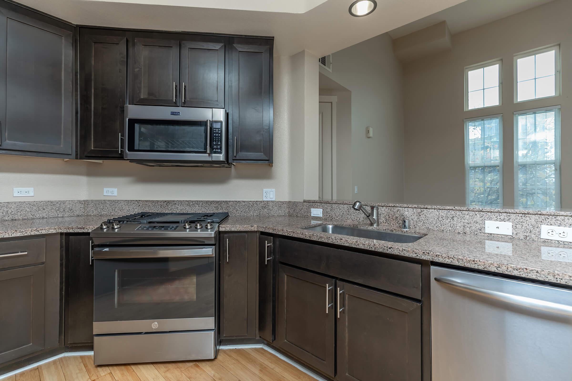 a large kitchen with stainless steel appliances