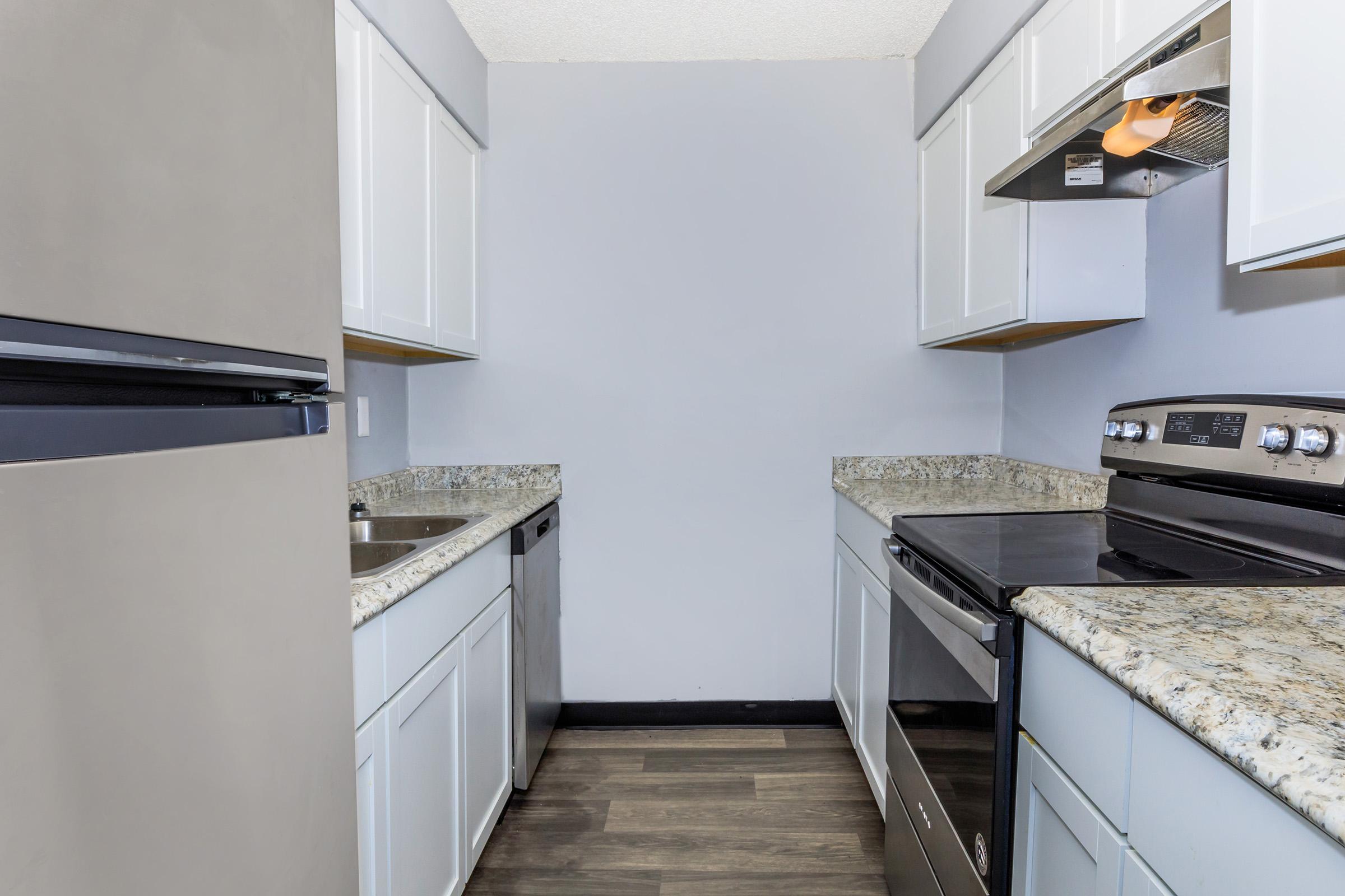 a kitchen with a stove and a sink