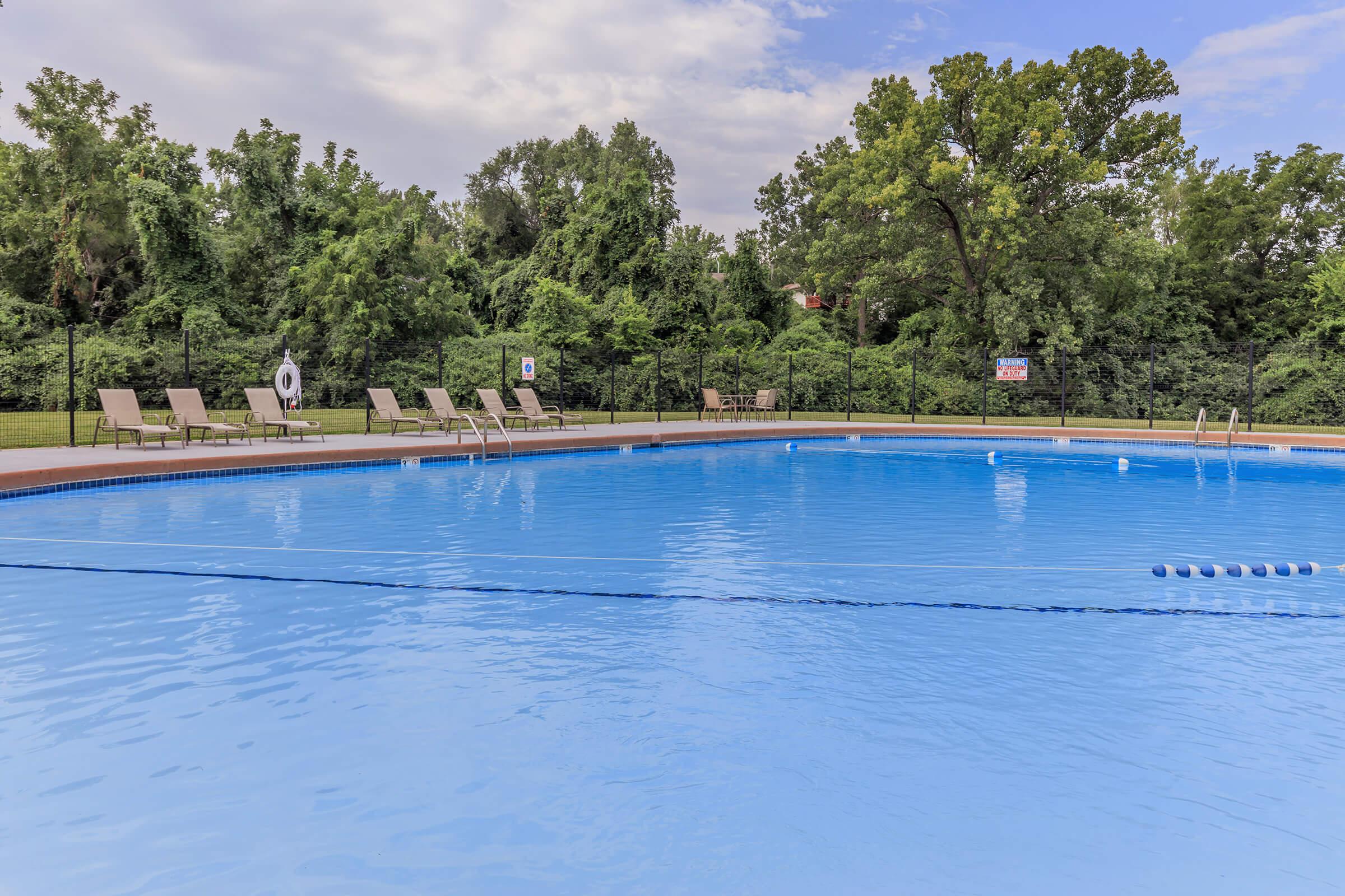 a pool next to a body of water