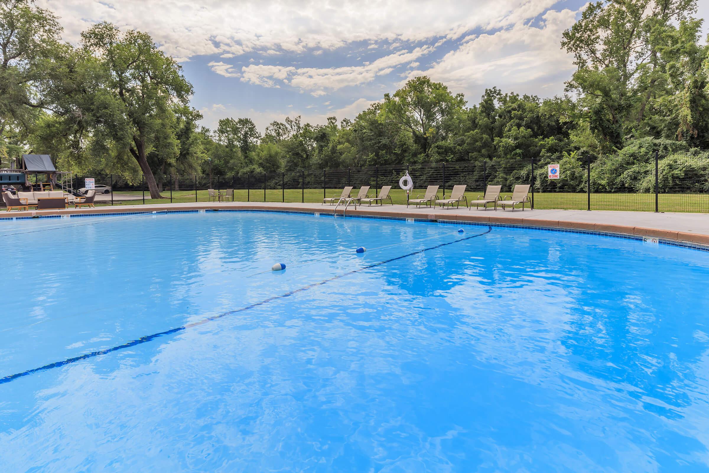 a pool next to a body of water