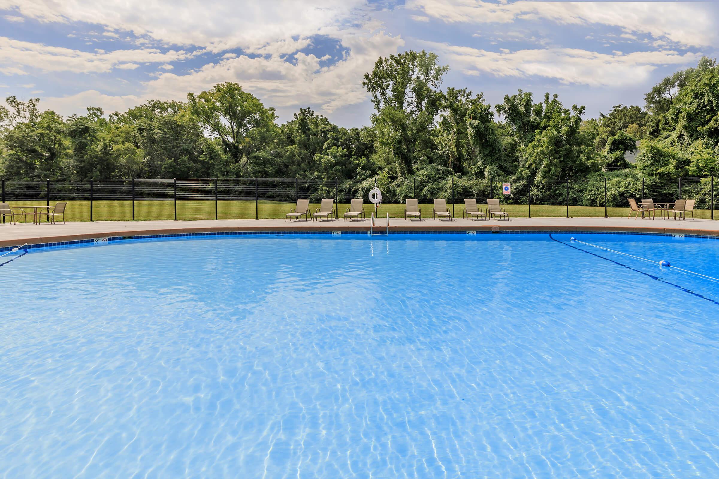 a pool next to a body of water