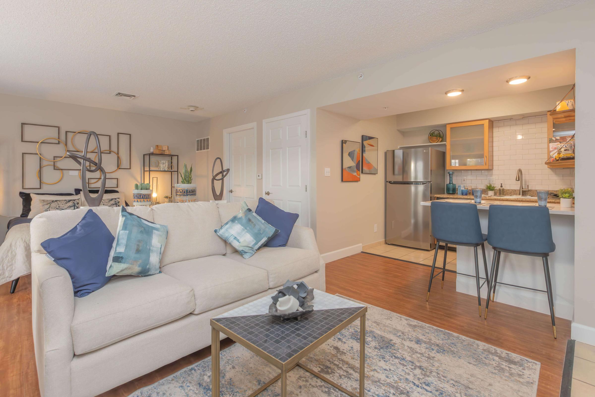 a living room filled with furniture and a table