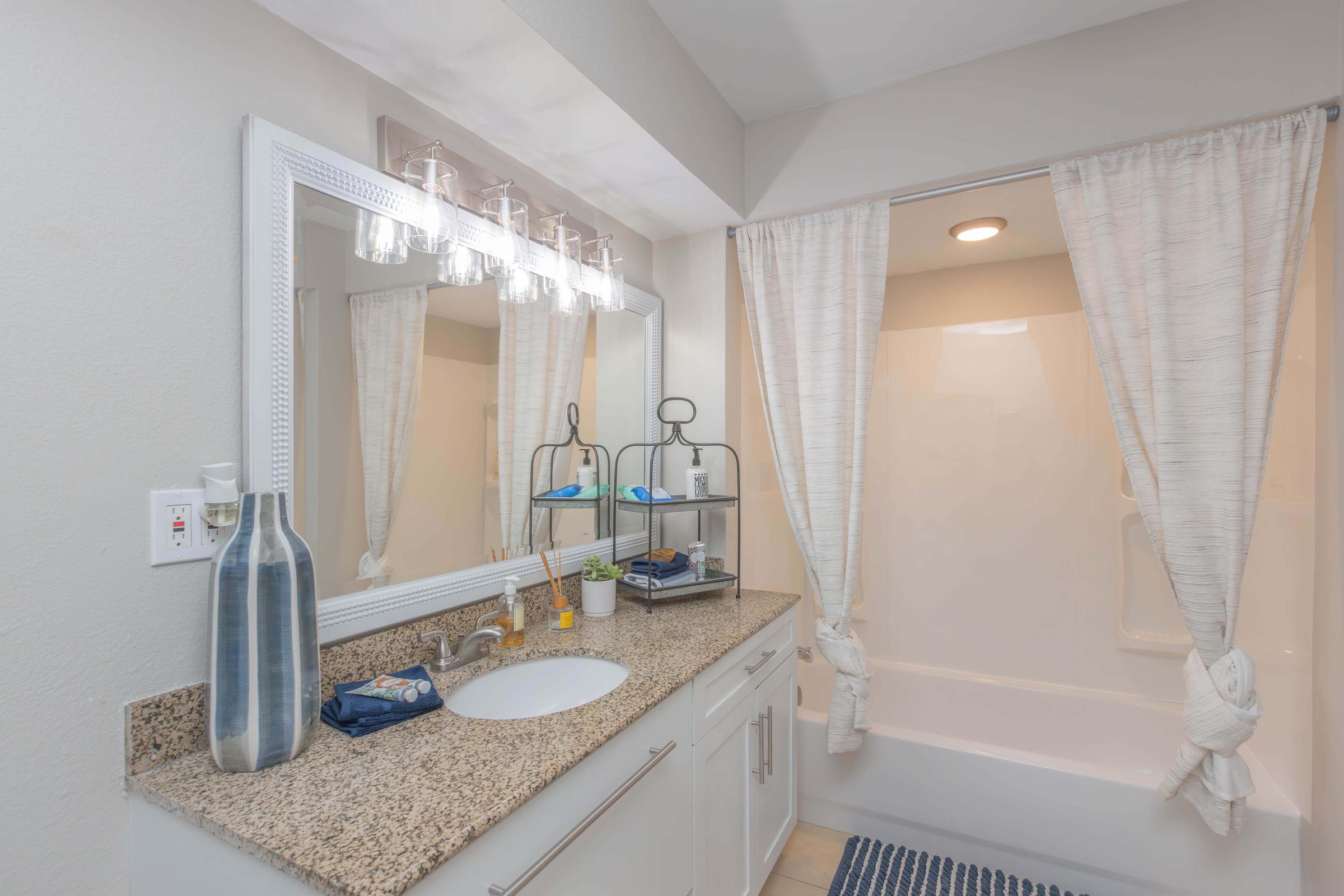 a kitchen with a sink and a shower