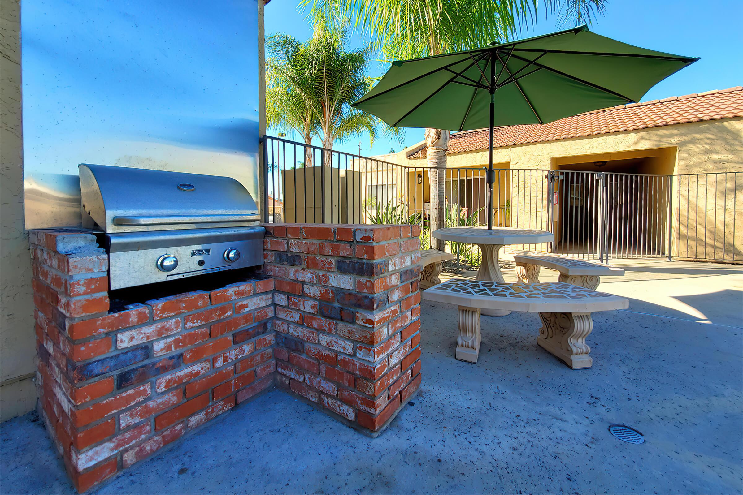 a table topped with a blue umbrella