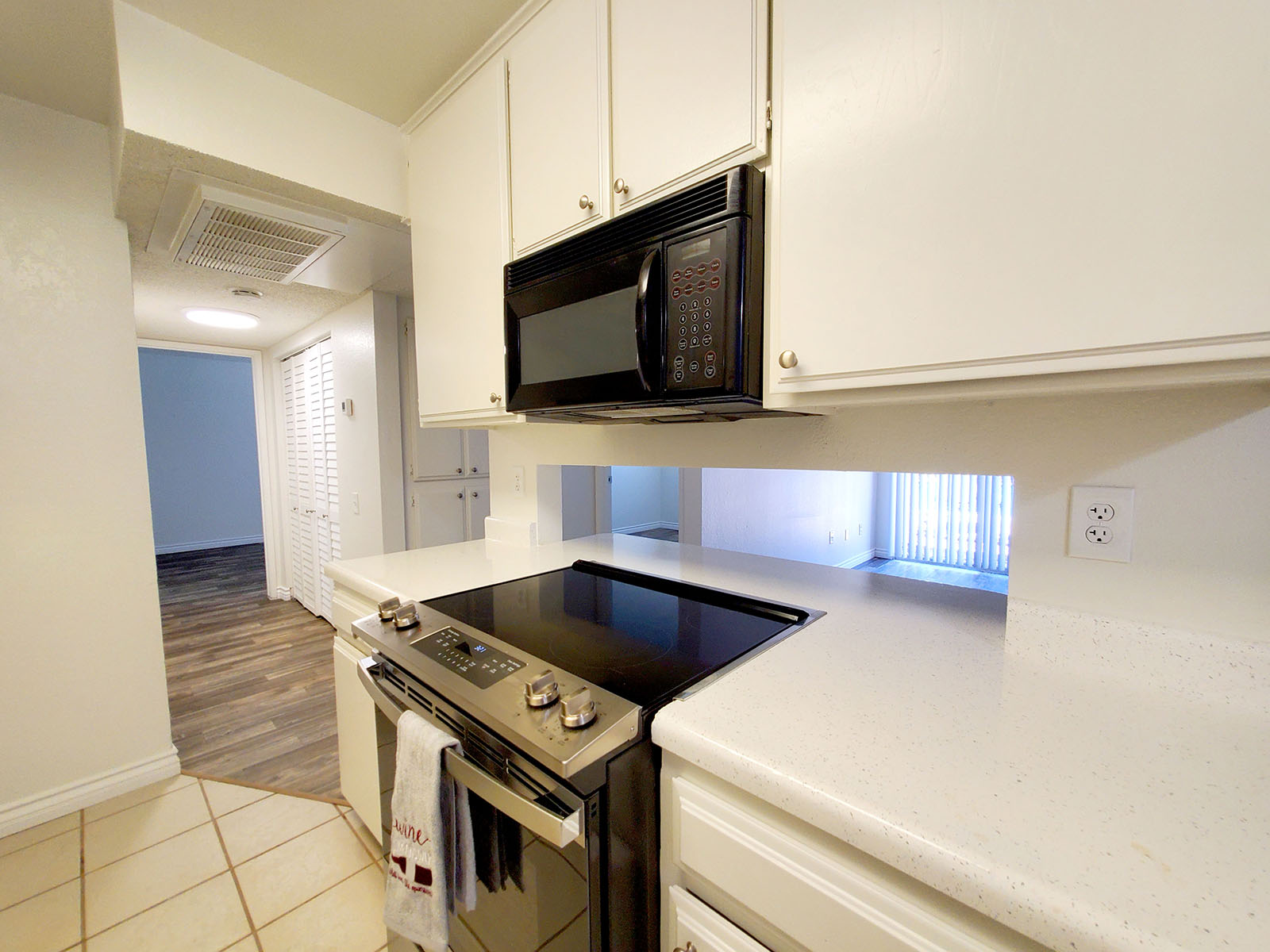 a stove top oven sitting inside of a kitchen