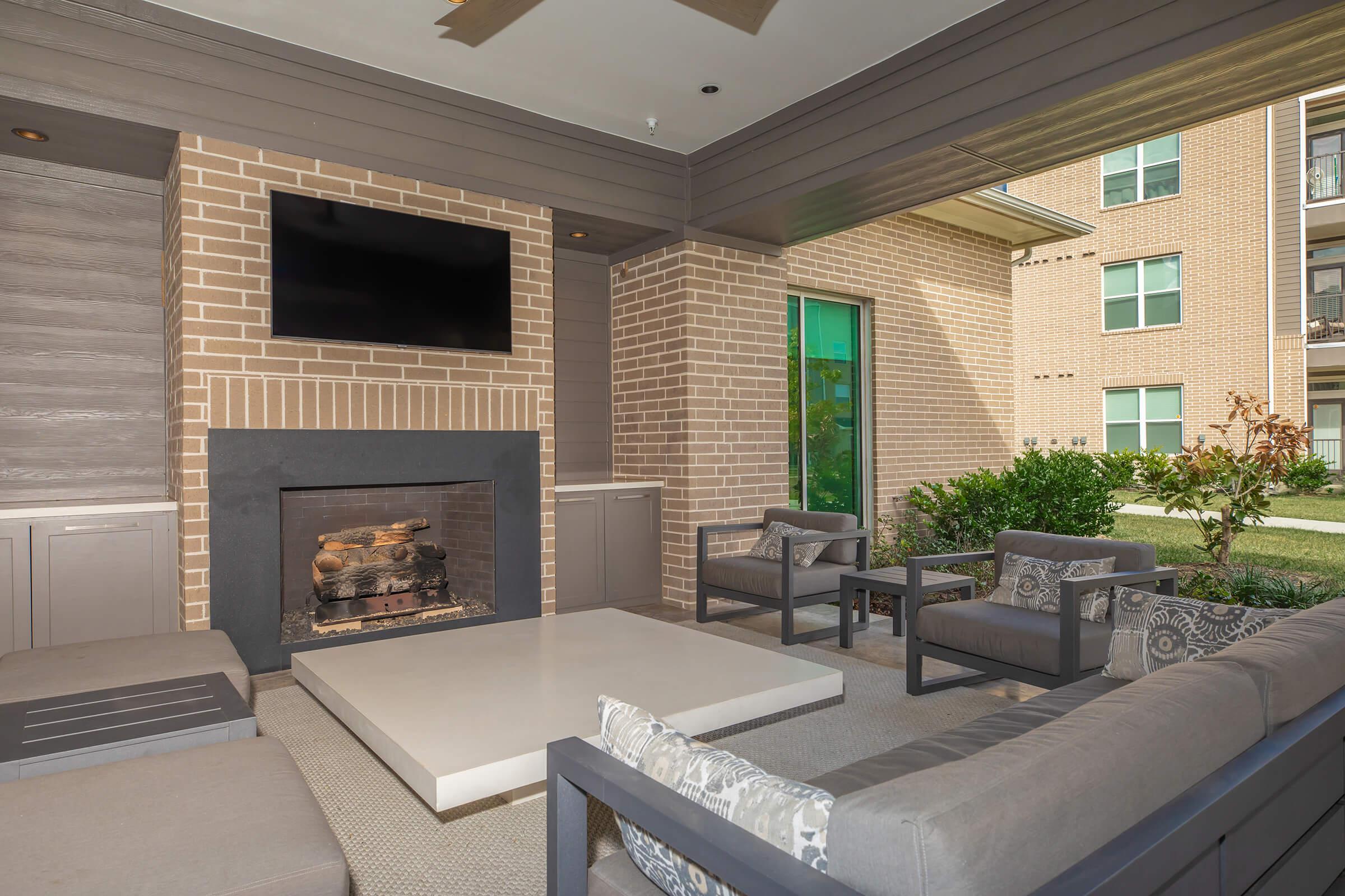 a living room filled with furniture and a fireplace