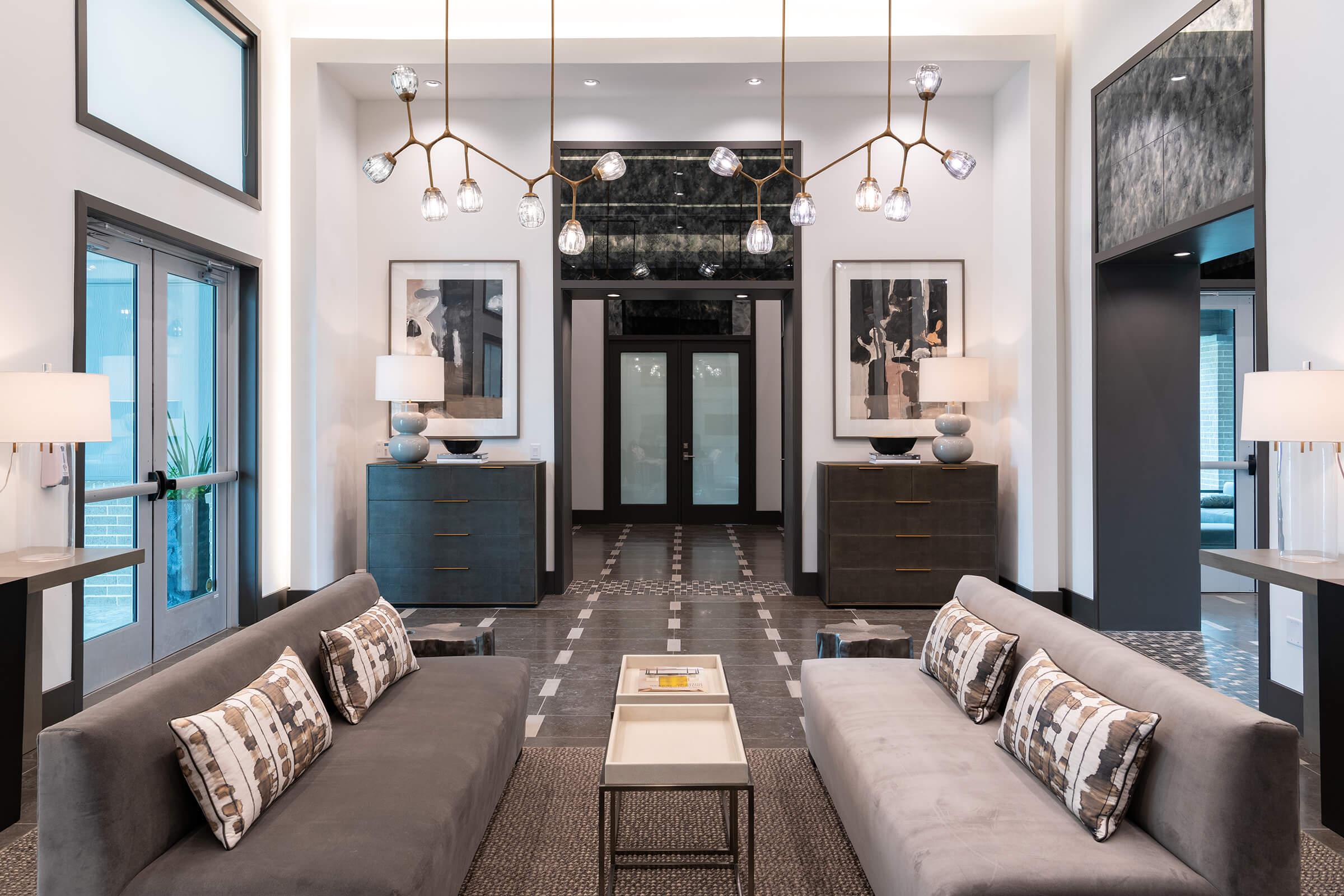 a living room filled with furniture and a large window