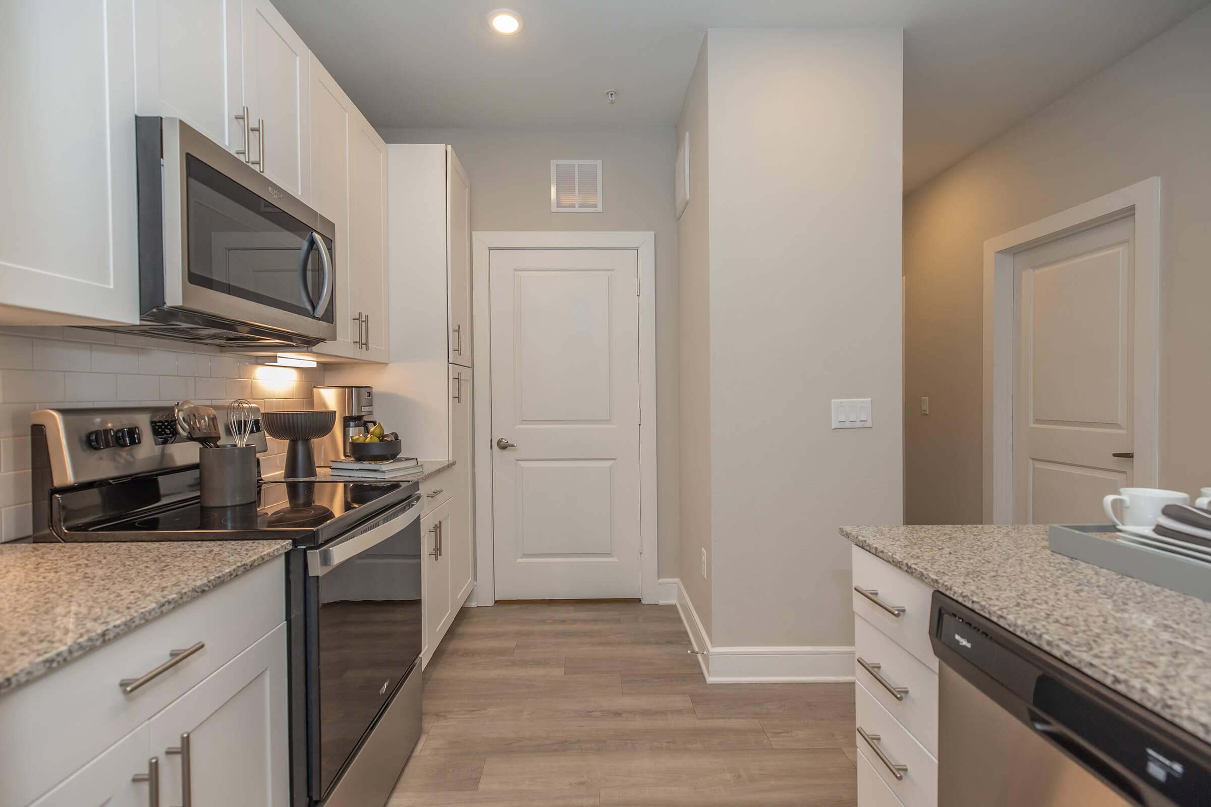 a modern kitchen with stainless steel appliances