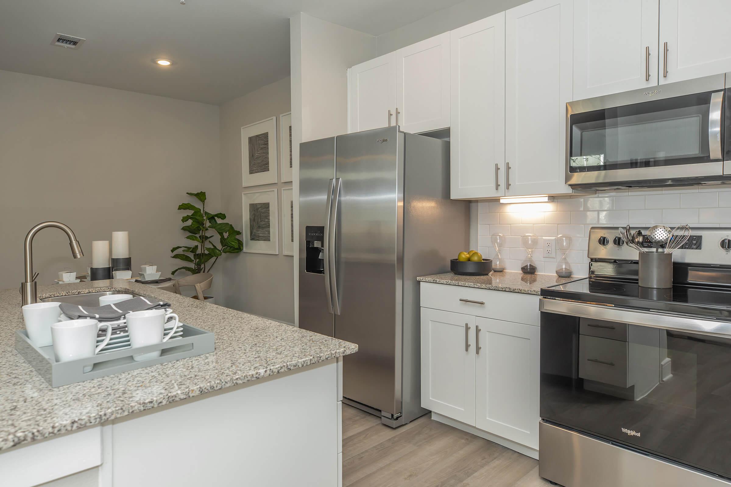 a modern kitchen with stainless steel appliances