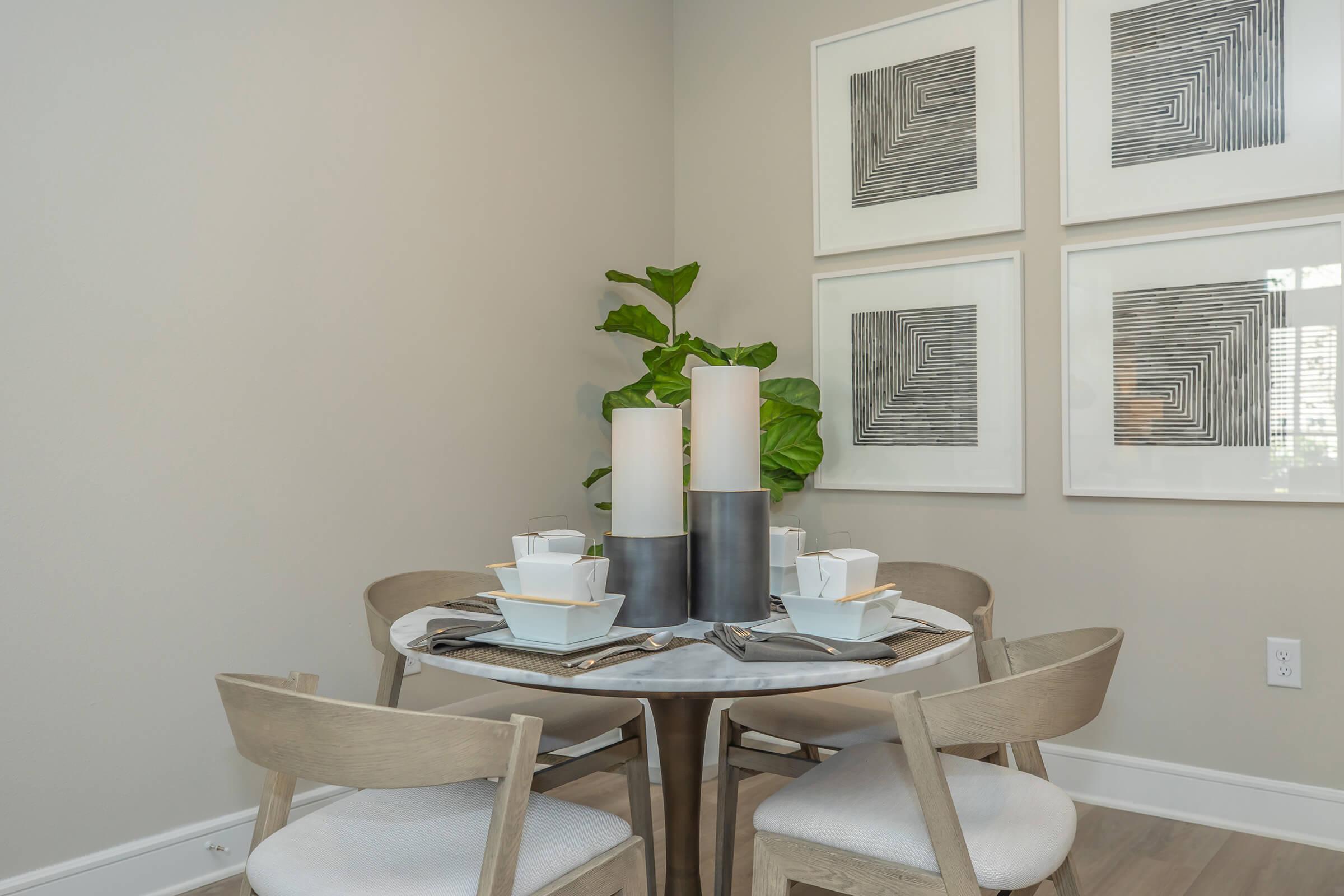 a room filled with furniture and vase on a table