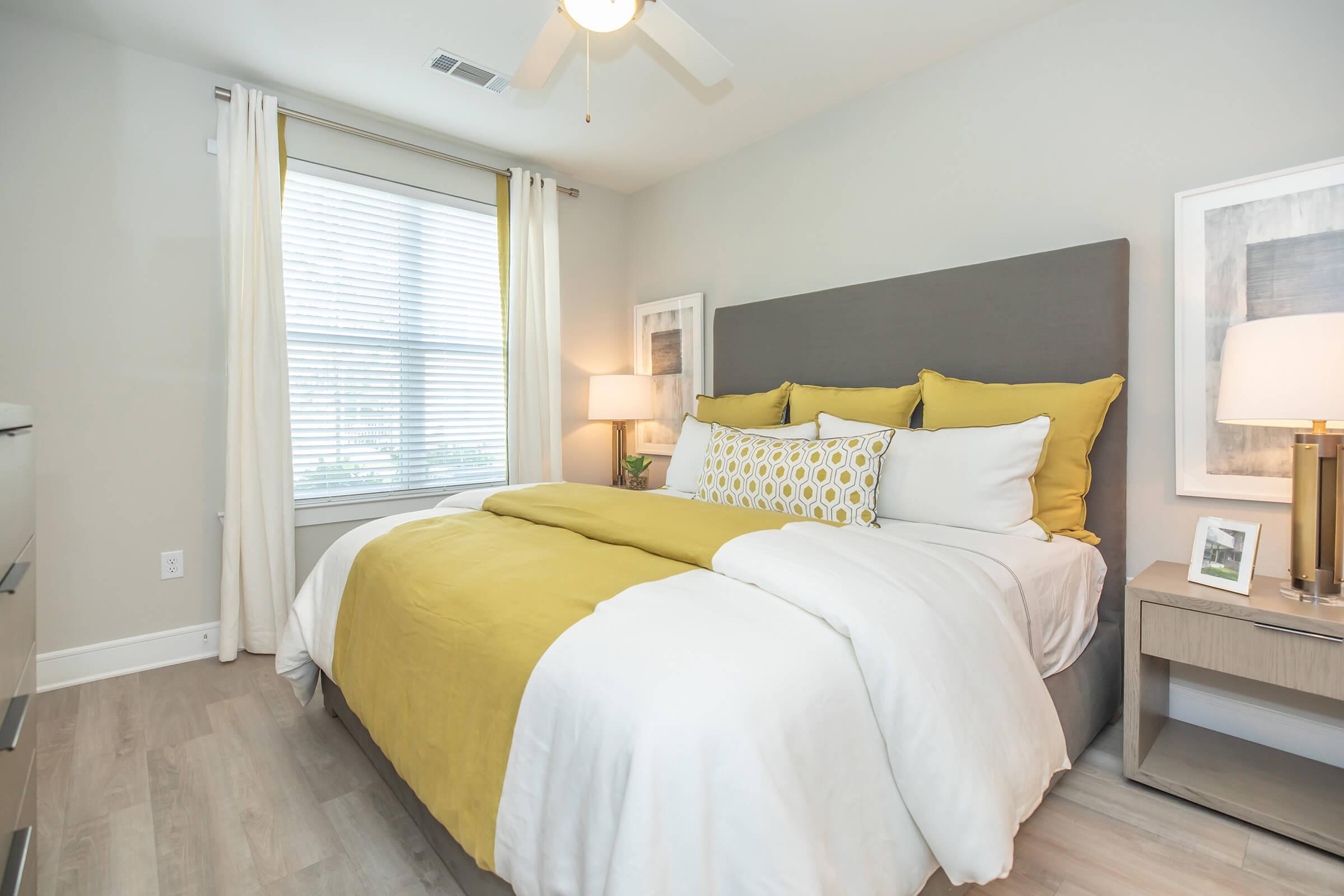 a bedroom with a large bed in a hotel room