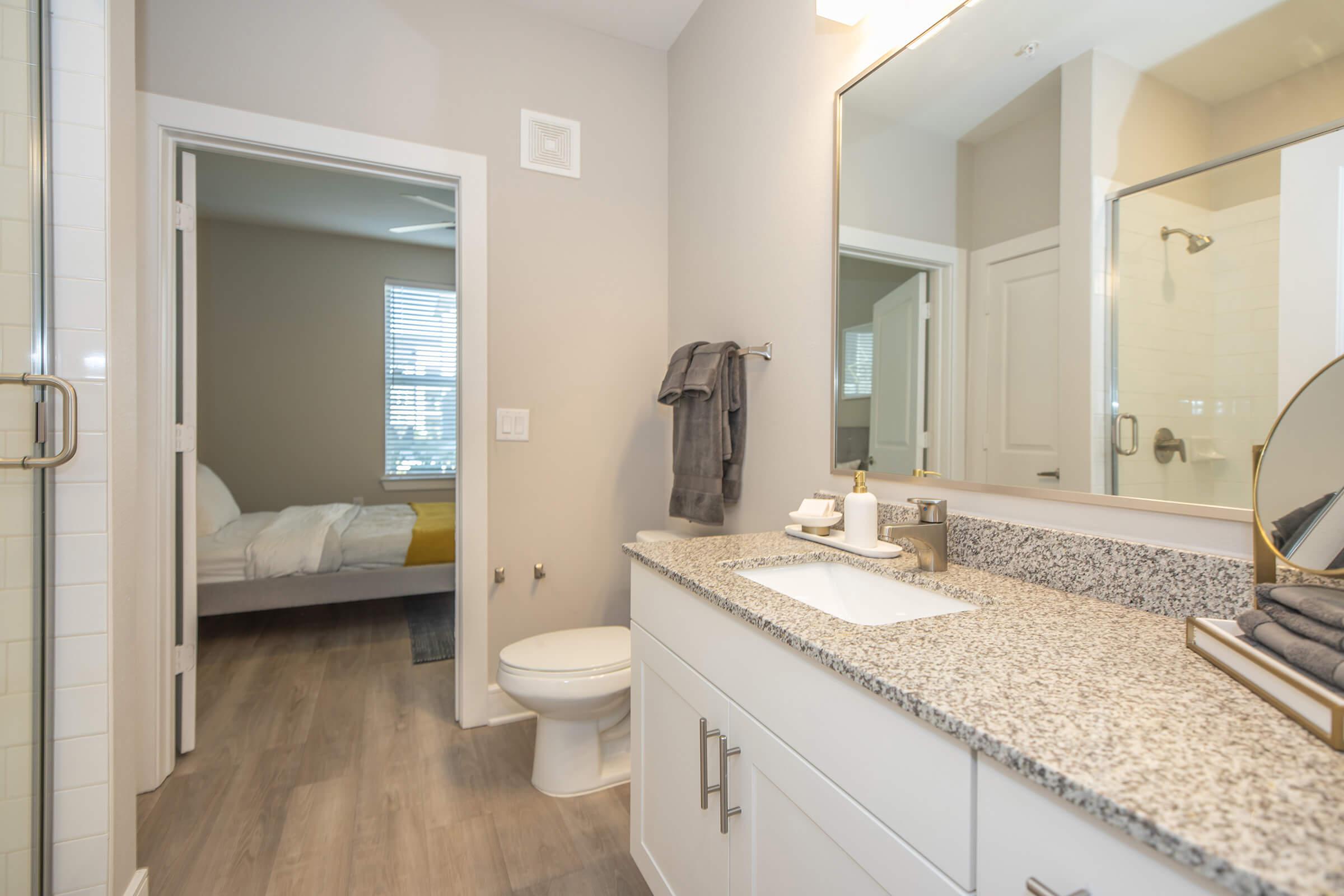 a kitchen with a sink and a mirror