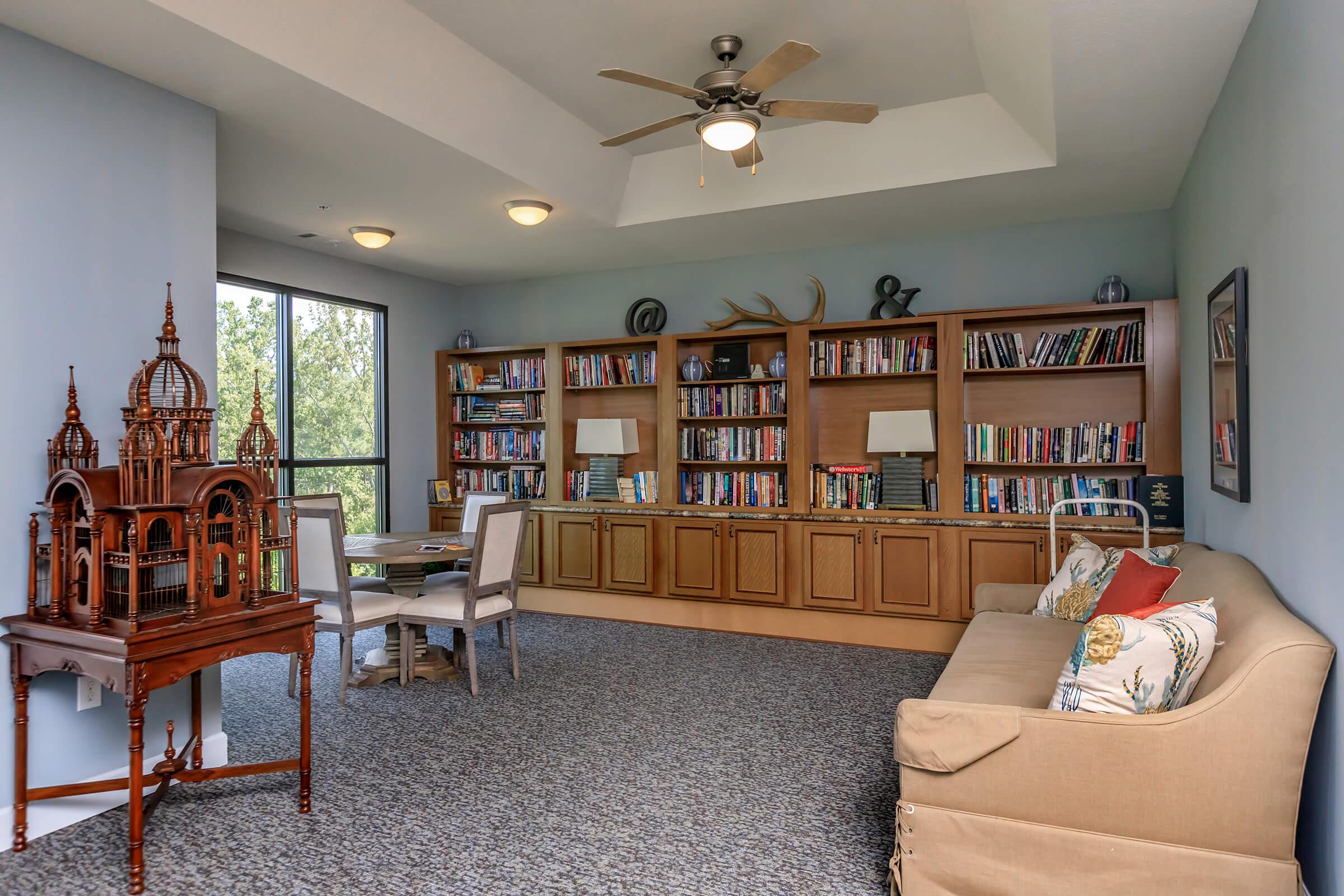 a living room filled with furniture and a fireplace