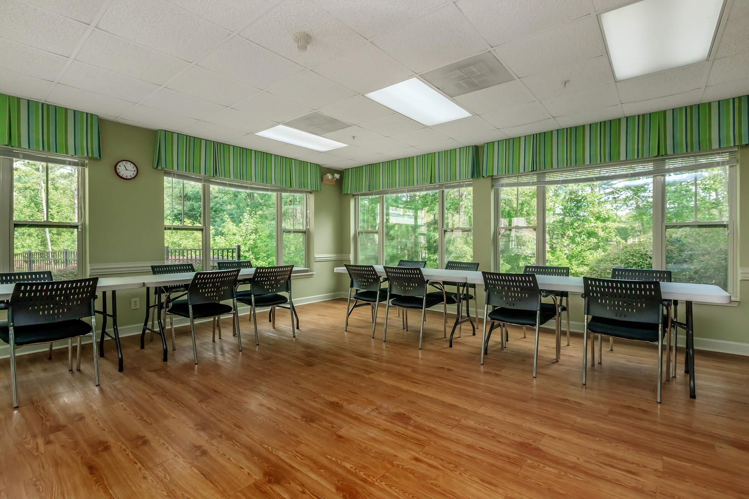 a living room filled with furniture and a large window