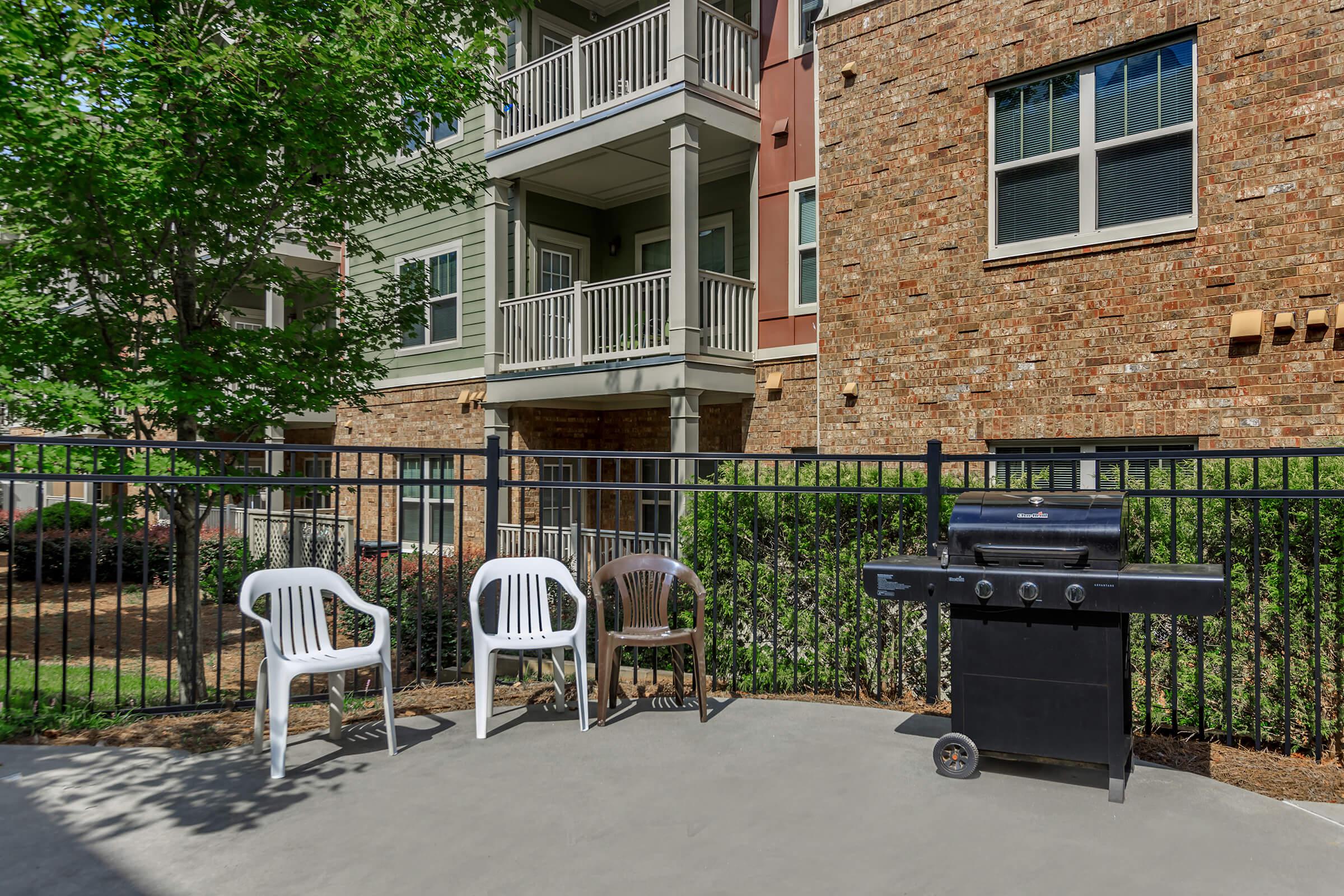 a bench in front of a brick building