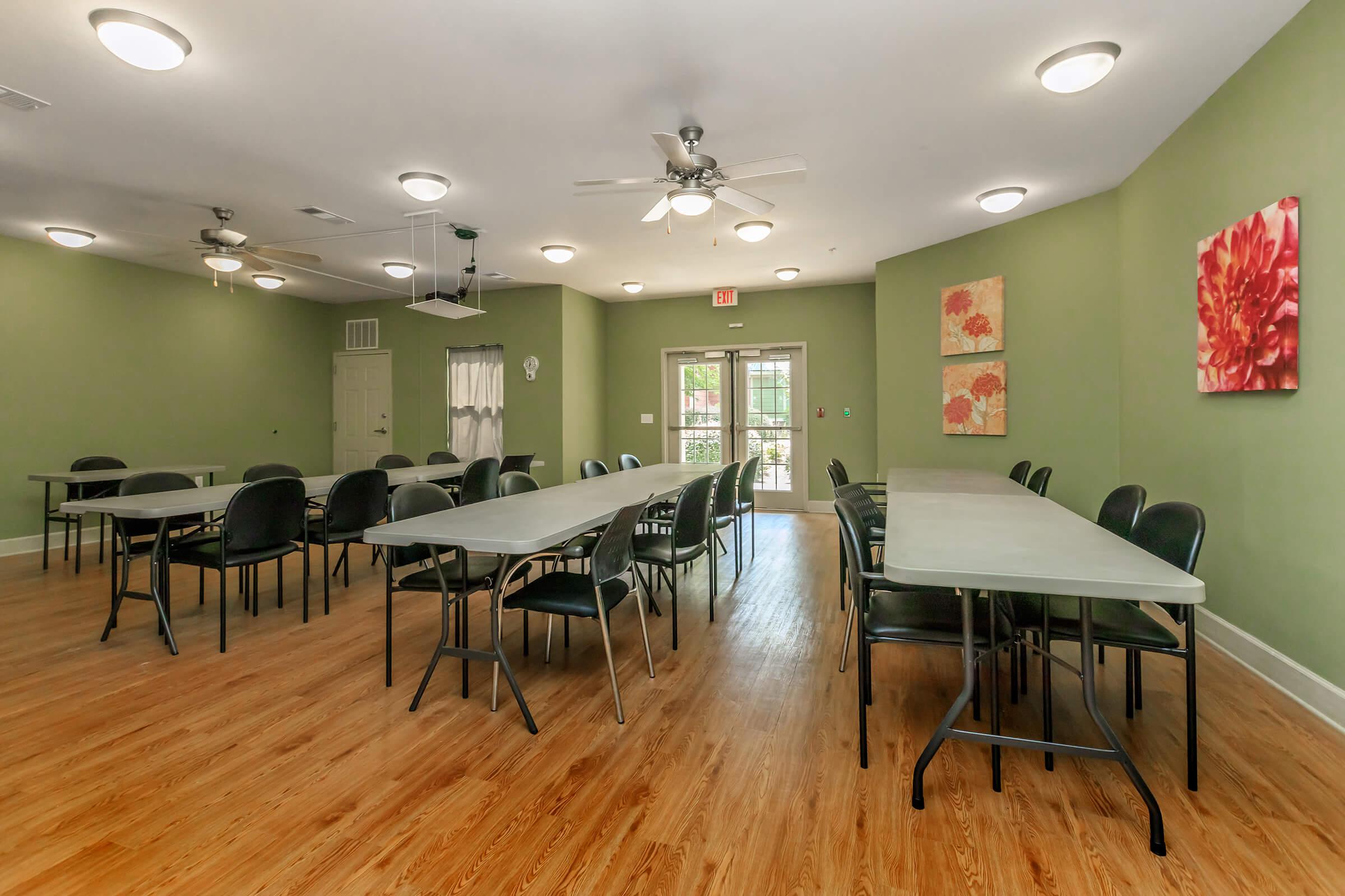 a room filled with furniture on top of a hard wood floor