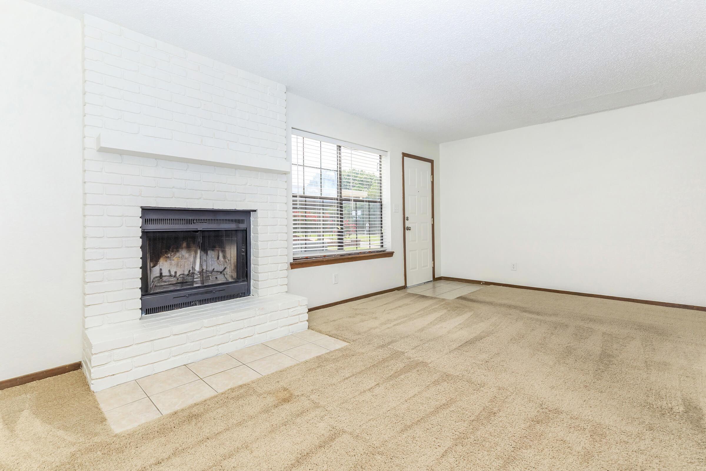 a room filled with furniture and a fireplace