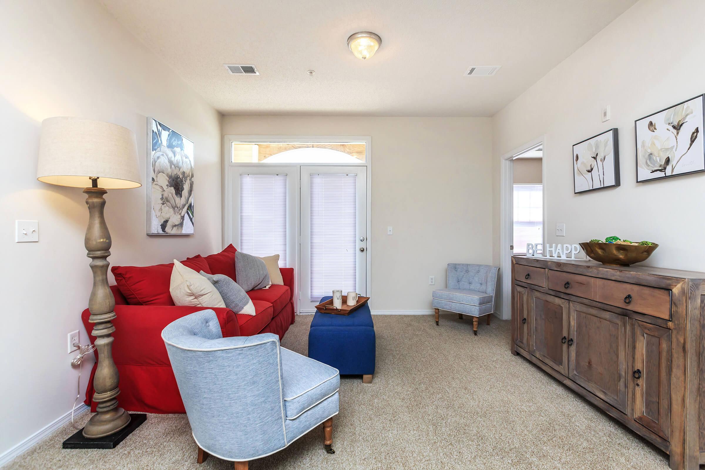 a living room filled with furniture and a flat screen tv