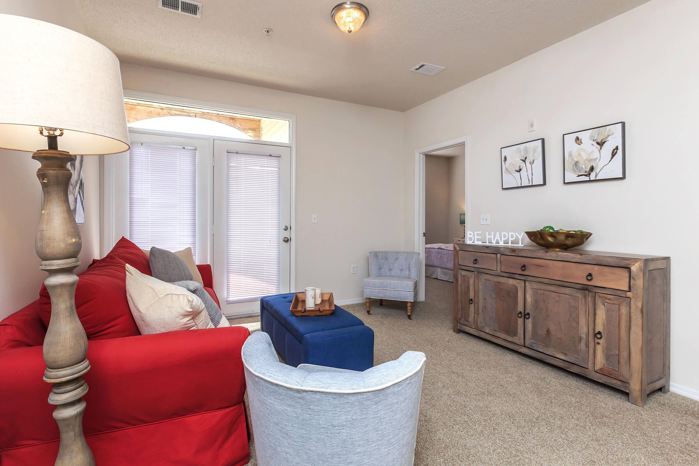 a living room filled with furniture and a tv