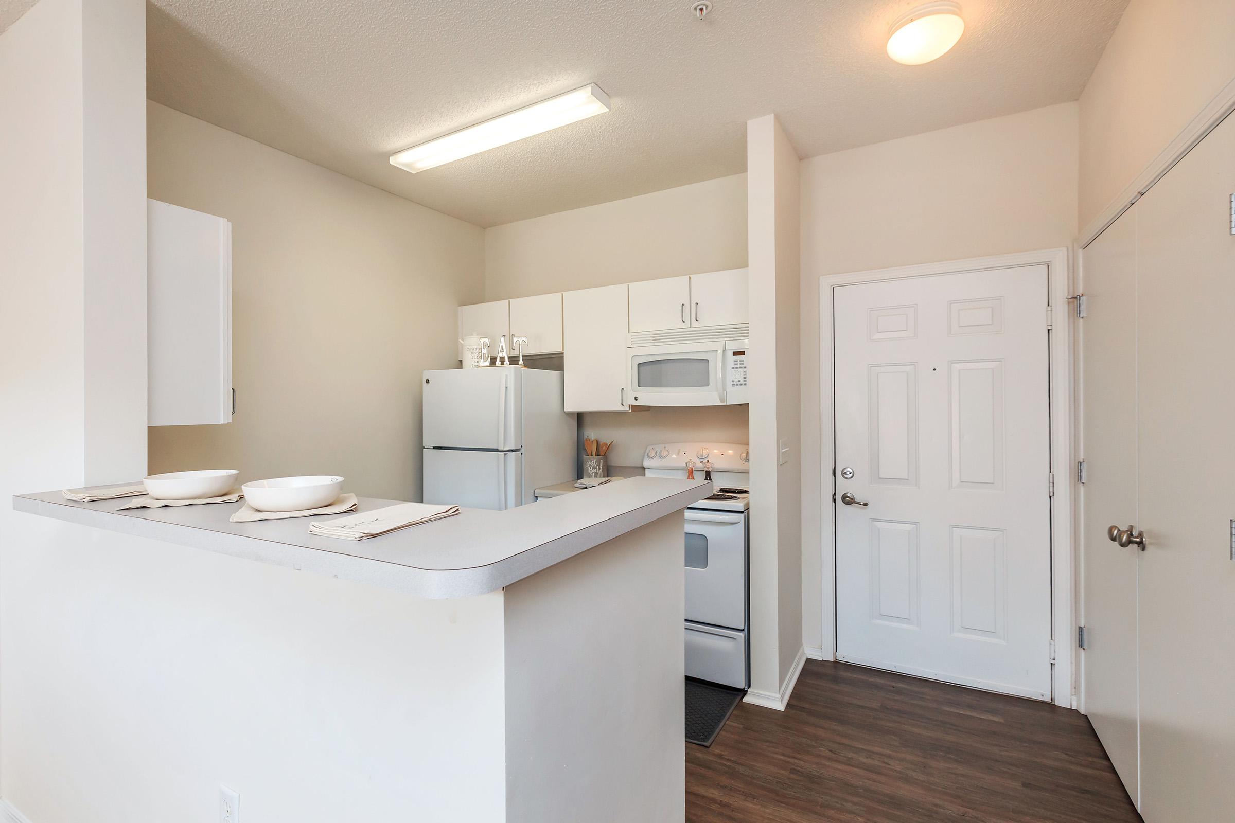 a large white refrigerator in a kitchen