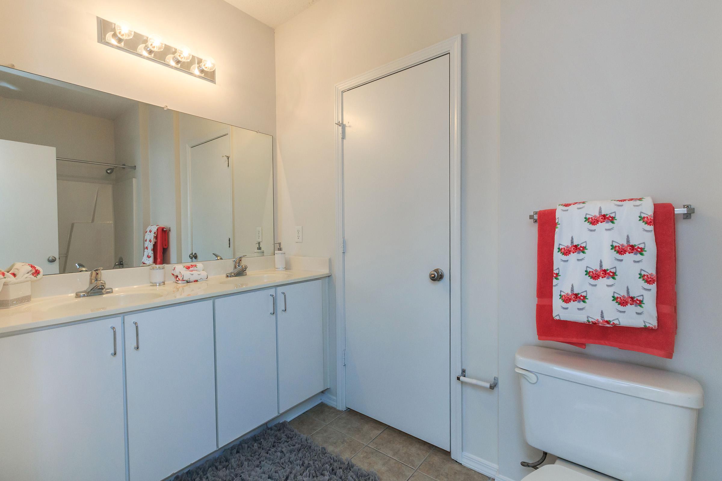 a kitchen with a sink and a mirror