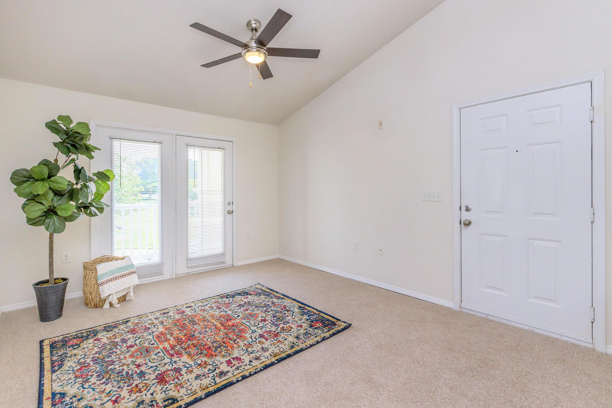 a bedroom with a large window