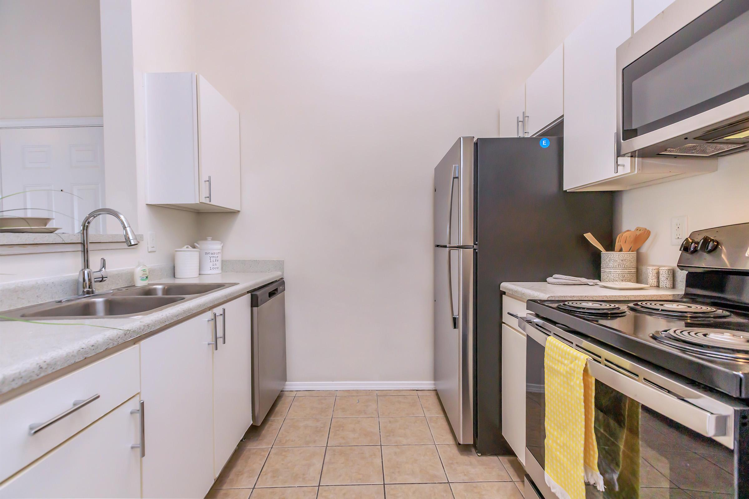 a kitchen with a stove and a sink