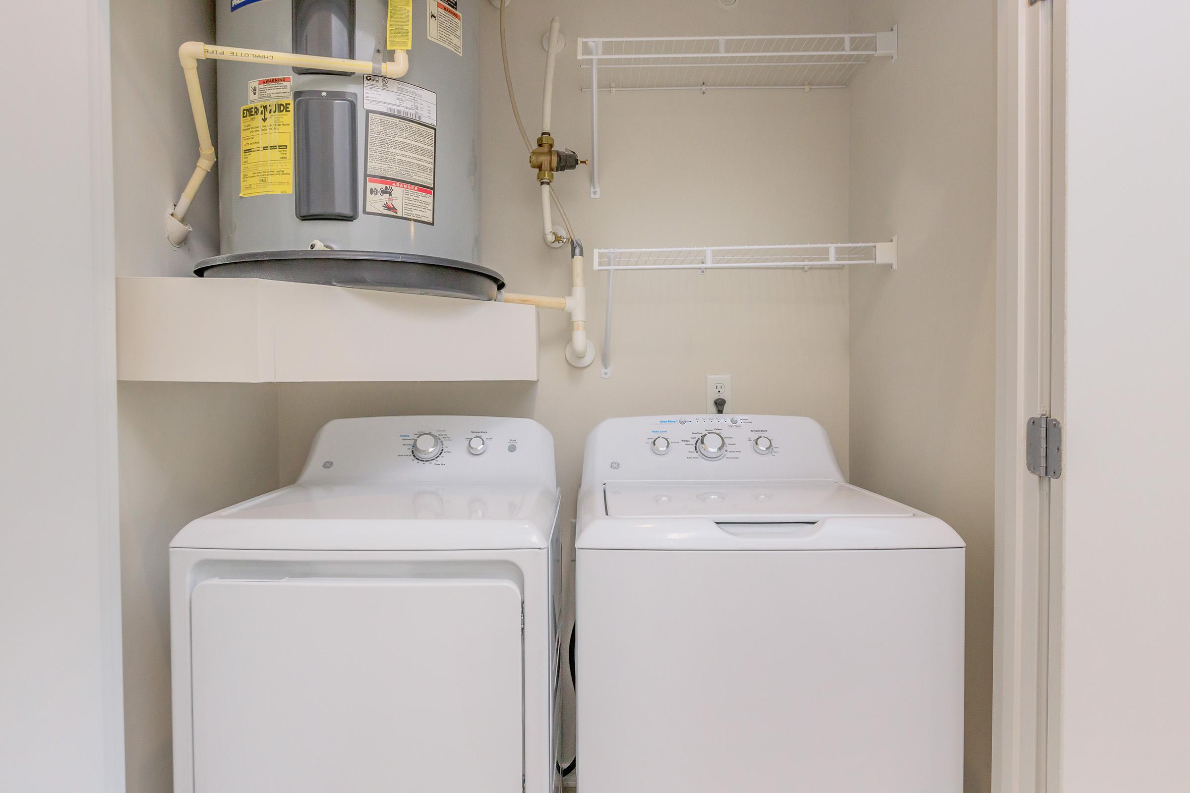 a refrigerator freezer sitting next to a sink