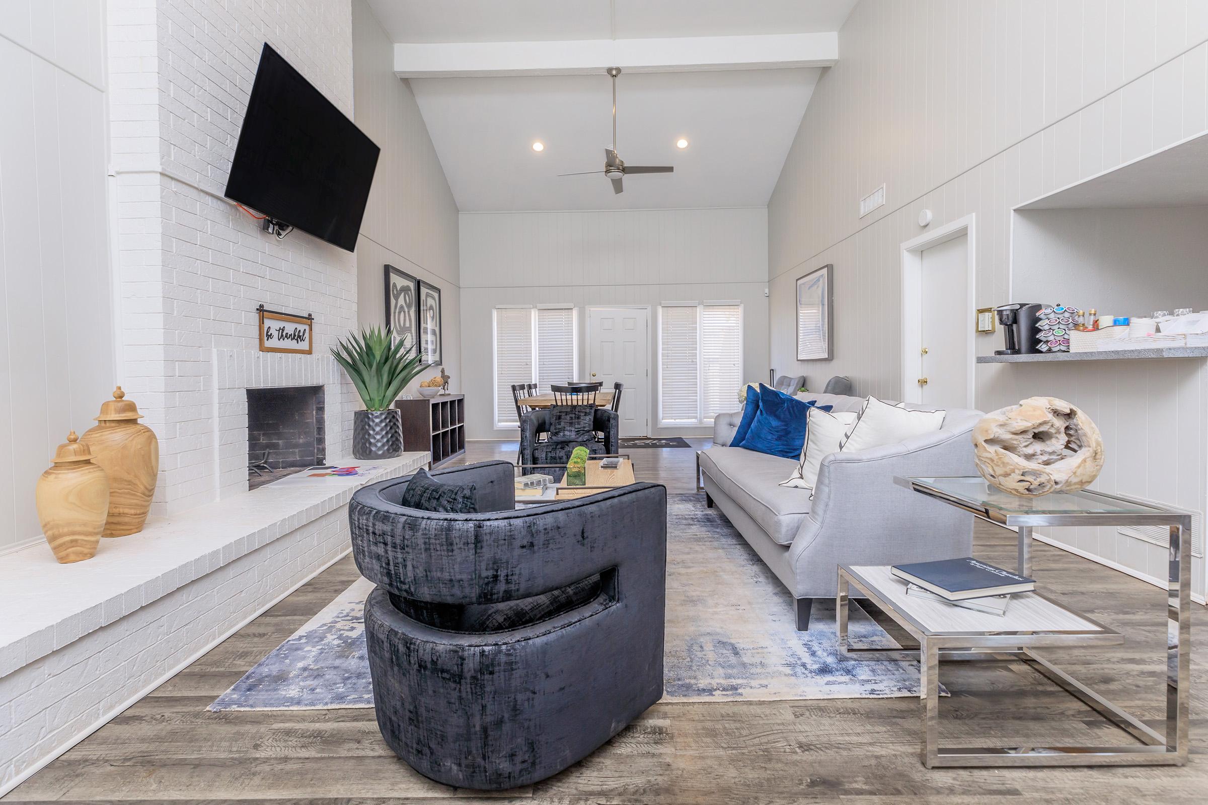 a room filled with furniture and a fireplace