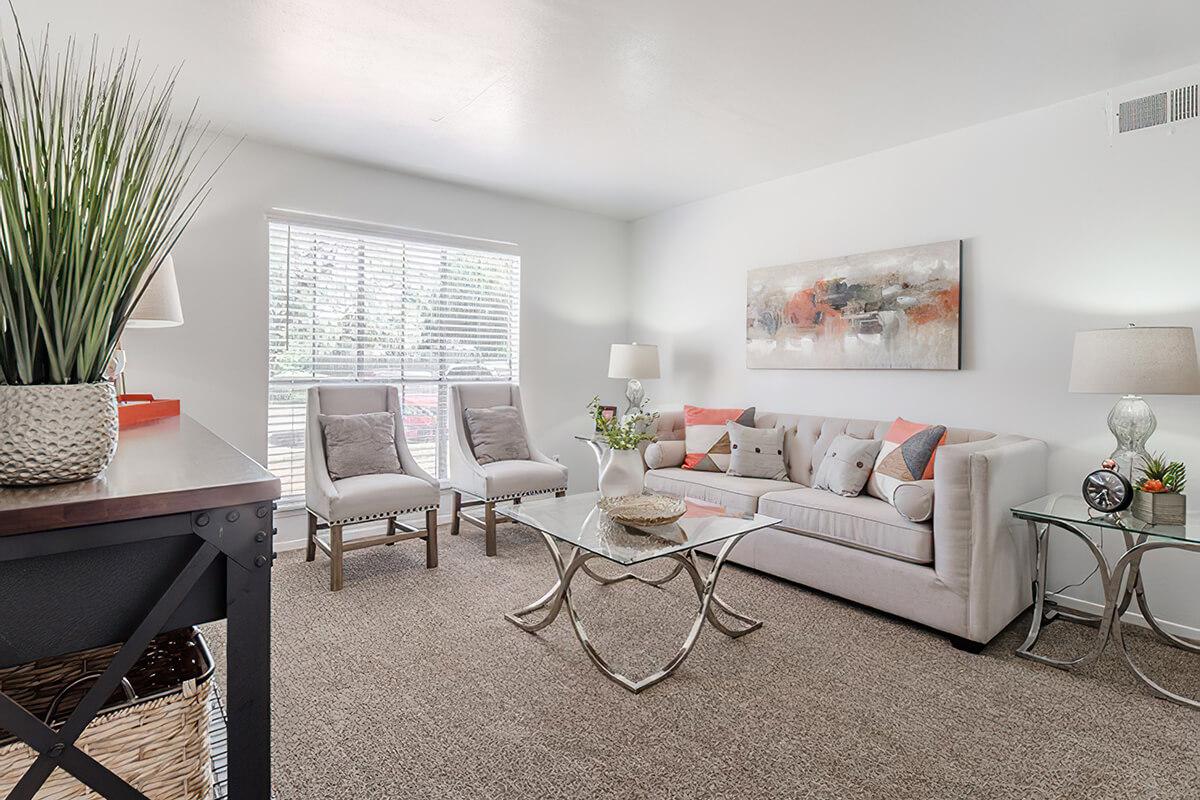 a living room filled with furniture and a fireplace