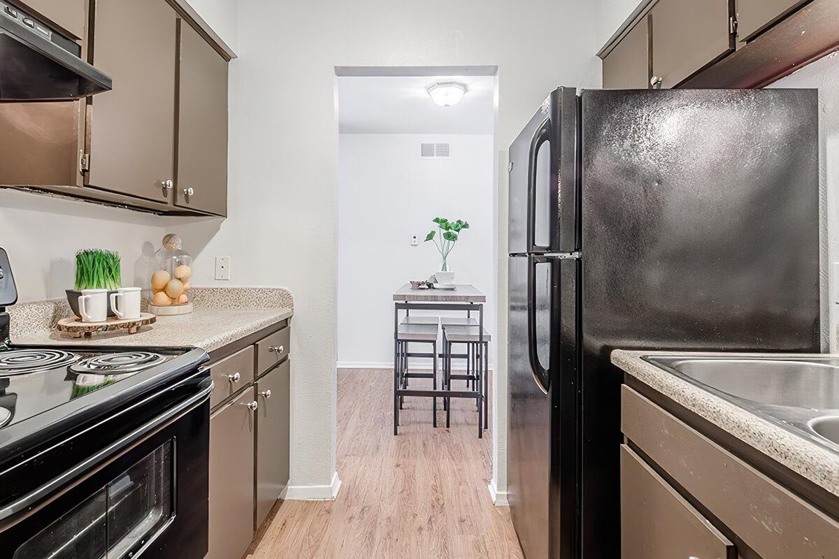 a kitchen with a stove top oven sitting inside of a refrigerator