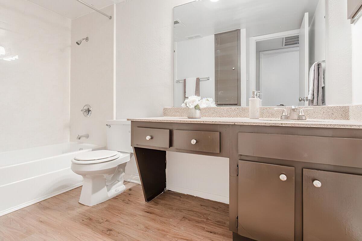 a kitchen with a sink and a mirror