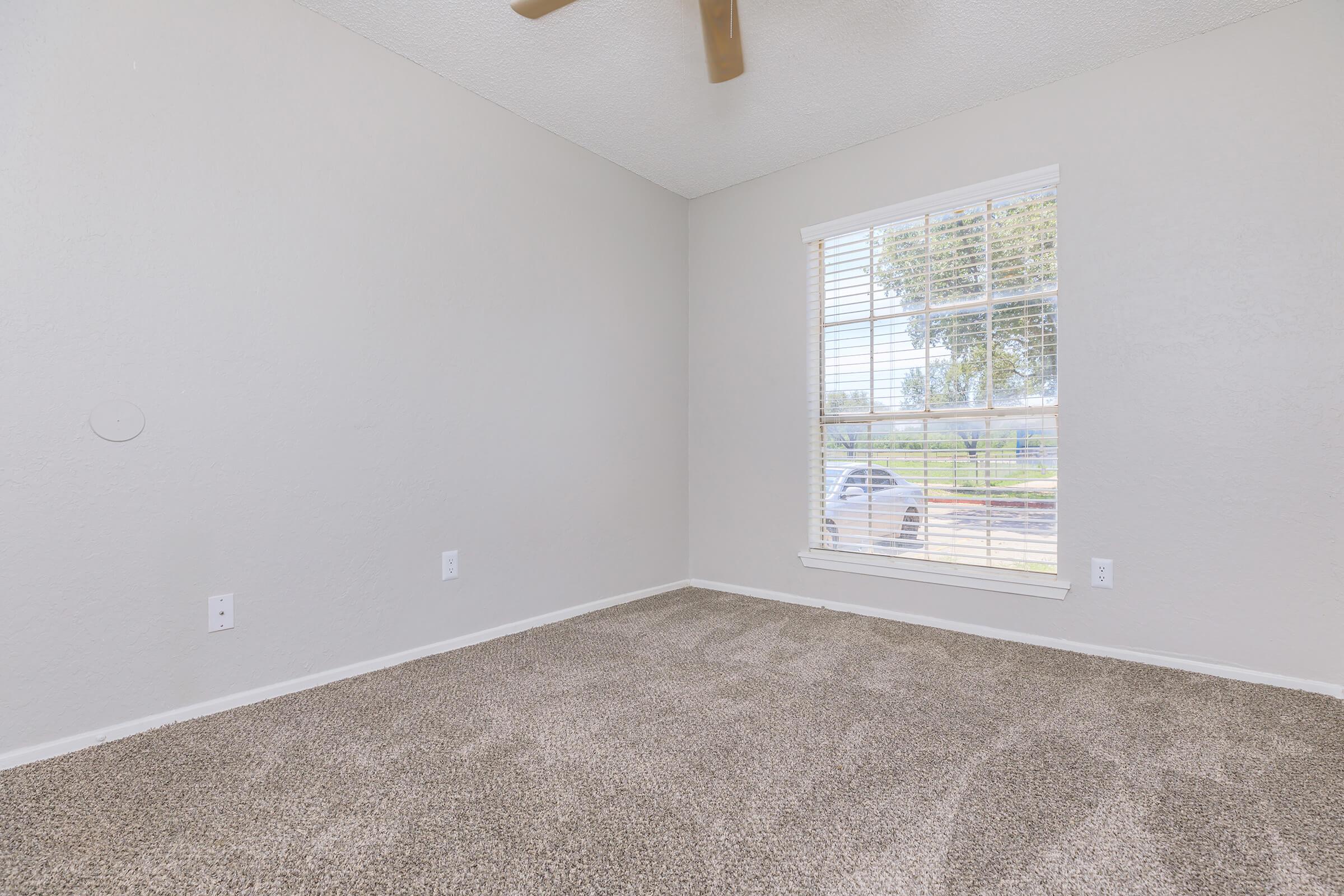 a bedroom with a large window